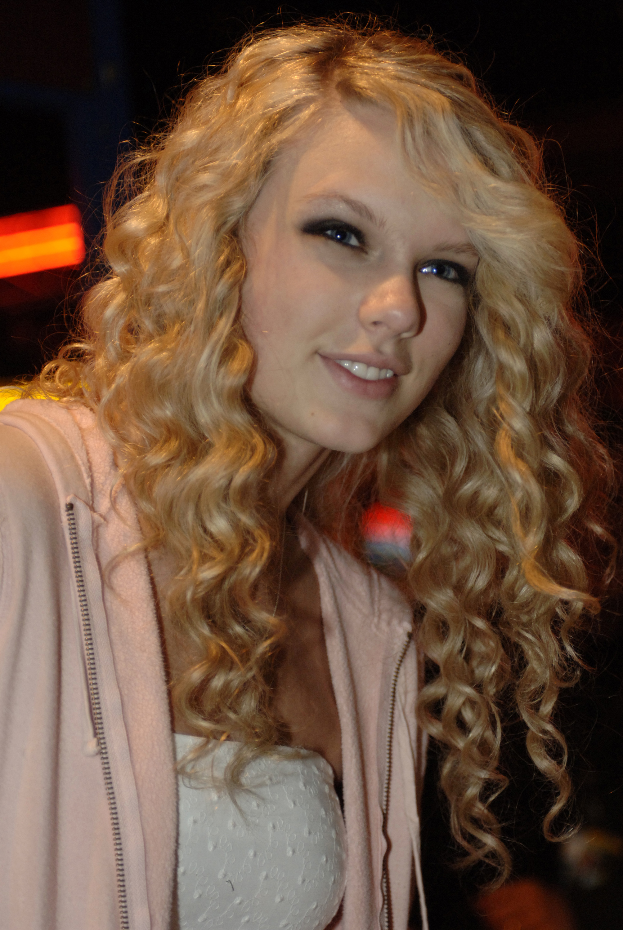 A young Taylor Swift smiles for the camera early in her music career. Before becoming a global superstar, she attended Hendersonville High School, where Kirk Schwabe taught her criminal justice and later remembered her as a remarkably observant student. | Source: Getty Images