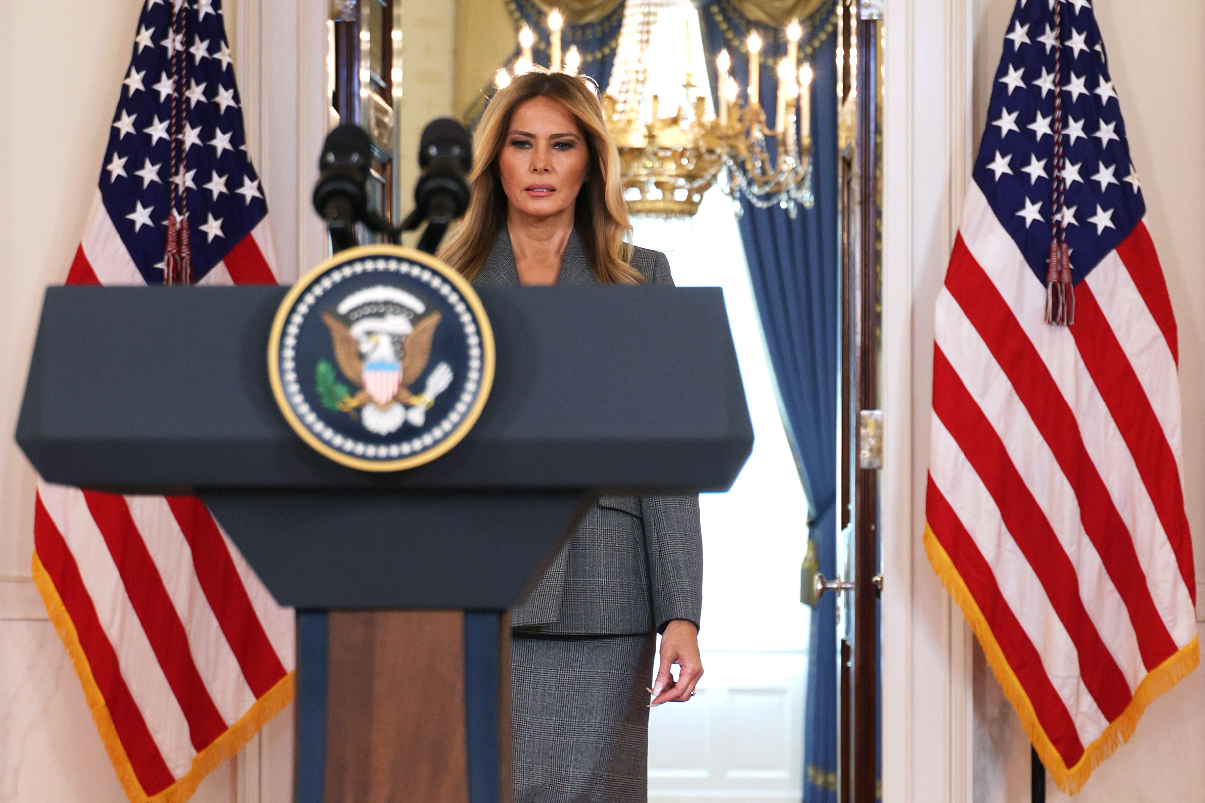 Melania Trump stands upright behind a podium at the White House in Washington, DC, on April 9, 2026 | Source: Getty Images