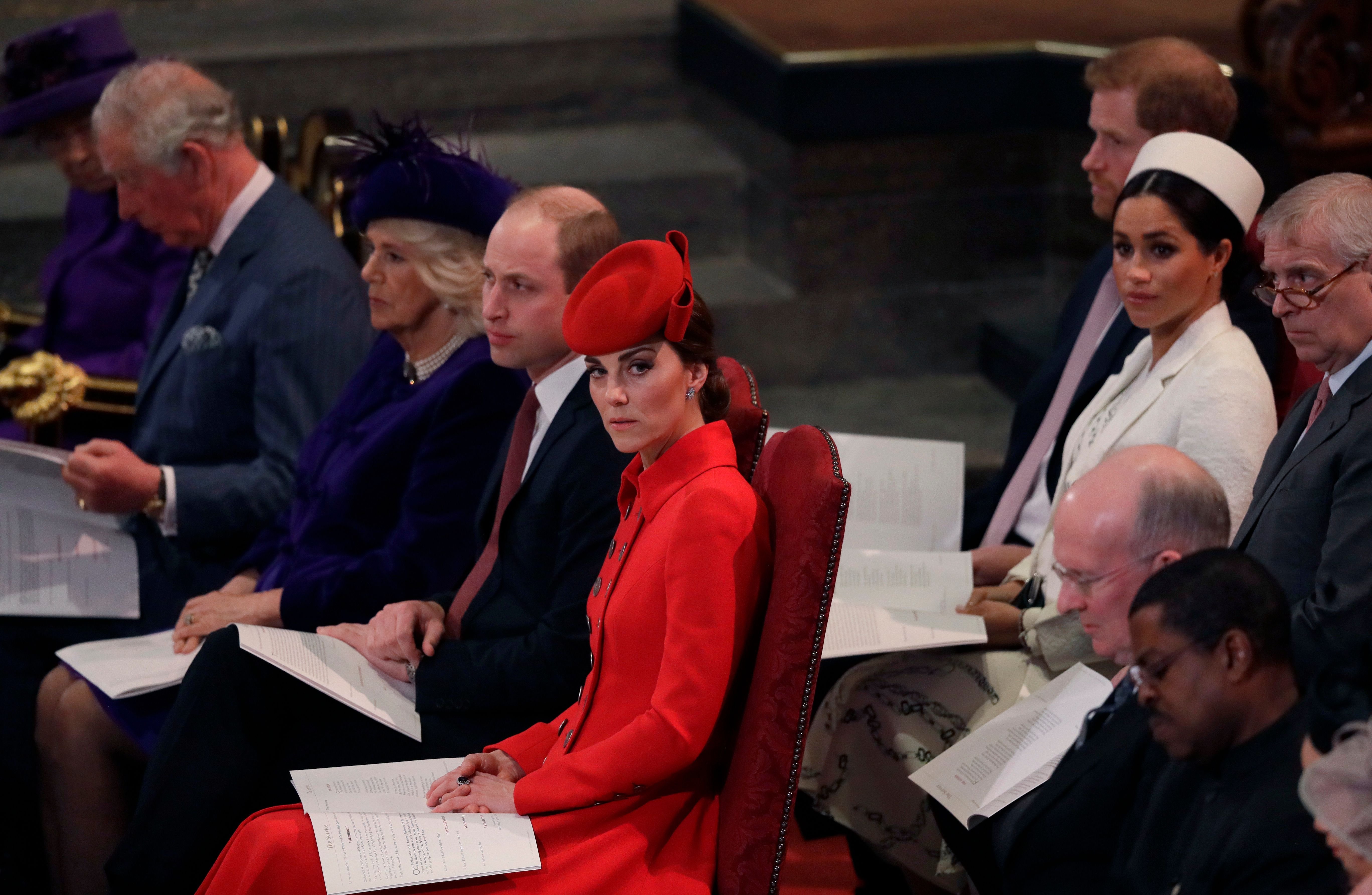 From L-R front row: Prince Charles, Camilla, Prince William, and Kate Middleton with (L-R second row) Prince Harry, Meghan Markle and Prince Andrew, pictured during the Commonwealth Day service on March 11, 2019 at Westminster Abbey in London. / Source: Getty Images