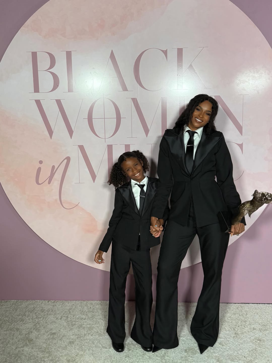 Ciara and Sienna Wilson posing at an event in matching outfits. | Source: Instagram/ciara