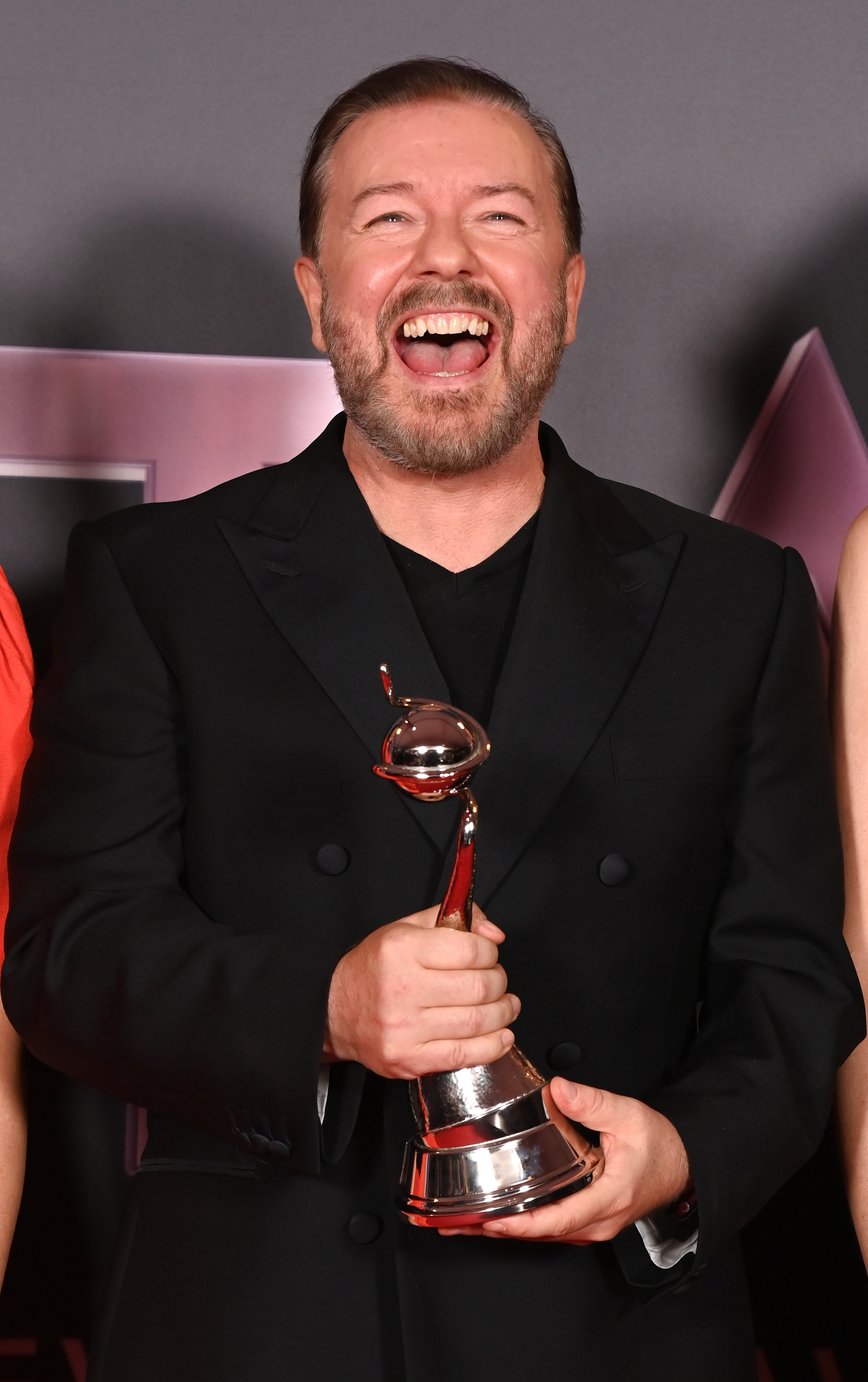 Ricky Gervais poses with the Comedy Award for 'After Life' in the winners' room at the National Television Awards 2022 at OVO Arena Wembley on October 13, 2022, in London, England. | Source: Getty Images