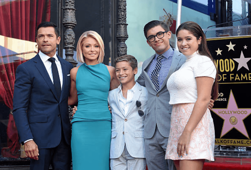 Kelly Ripa, Mark Consuelos their children Lola Consuelos, Michael Consuelos and Joaquin Consuelos pose for camera's at the ceremony for Kelly Ripa's star on the Hollywood Walk of Fame, on October 12, 2015, in Hollywood, California | Source: Getty Images