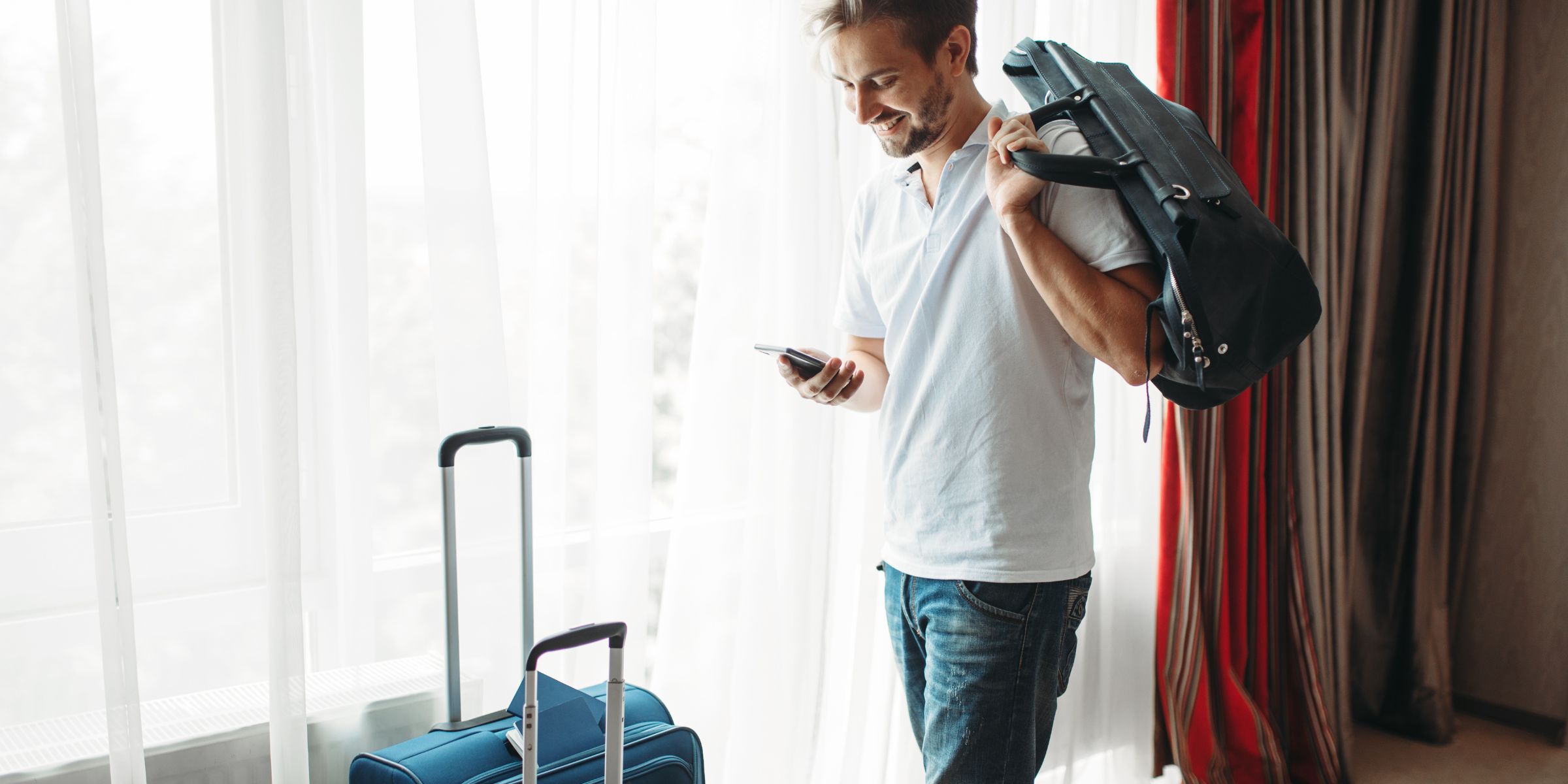 A man with his luggage | Source: Shutterstock