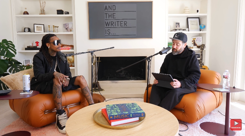 Wiz Khalifa sits down with host Ross Golan for a wide-ranging conversation about his rise from mixtape culture to international success. | Source: YouTube/And The Writer Is...