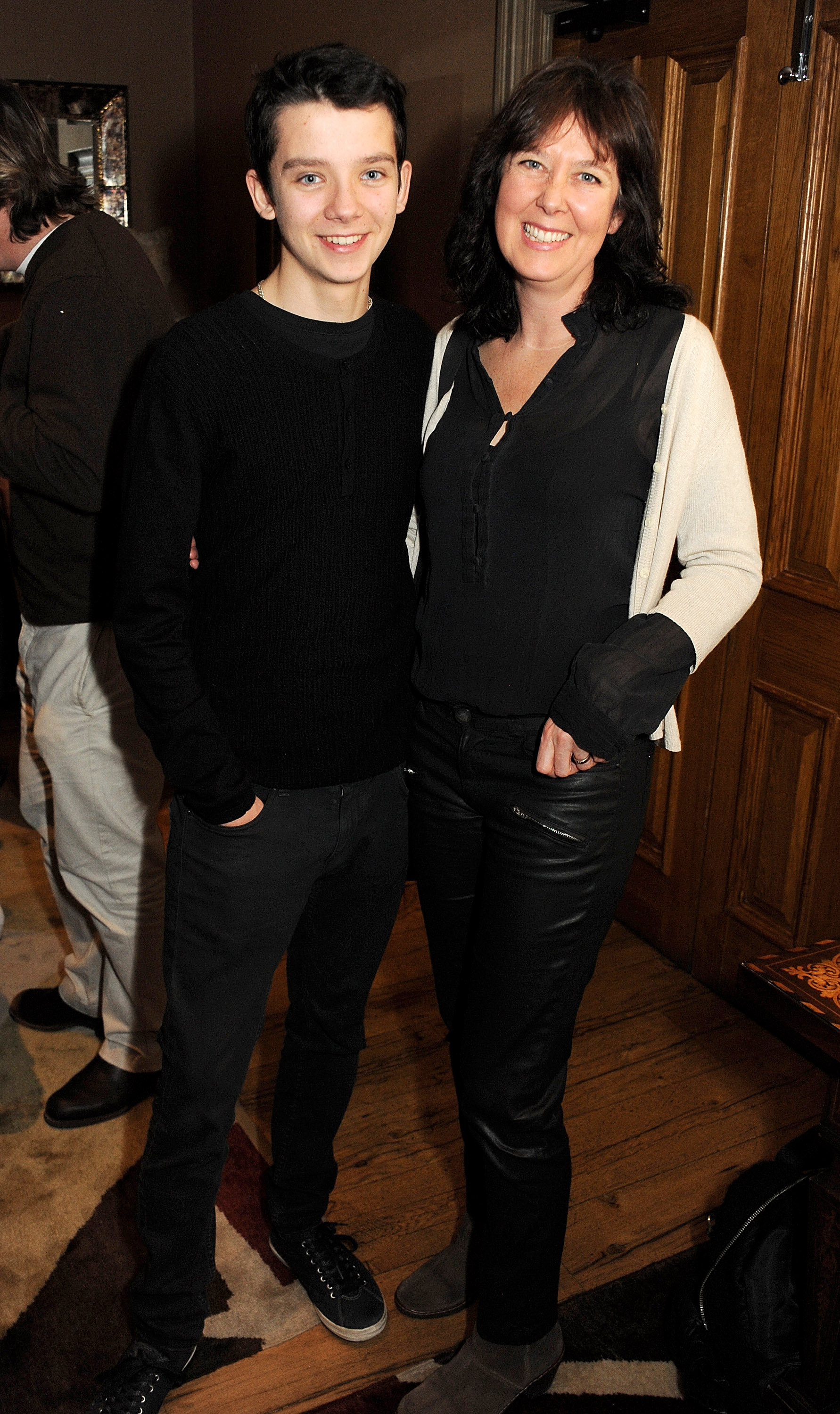 Asa Butterfield (L) and his mother, Jacqueline Farr, attend a screening of 'Silver Linings Playbook' hosted by Harvey Weinstein at the Charlotte Street Hotel on December 16, 2012, in London, England. | Source: Getty Images