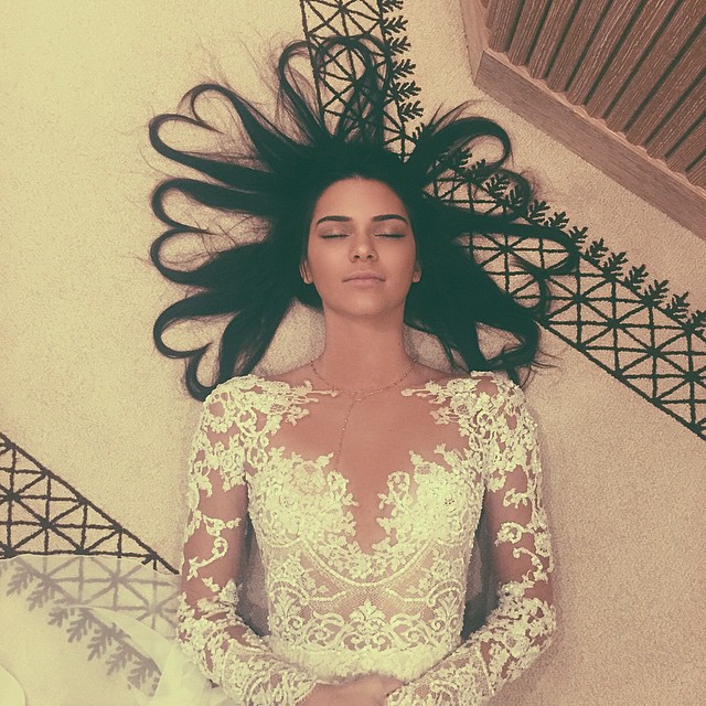 Kendall Jenner pictured on the floor, dated May 2015 | Source: Instagram/kendalljenner