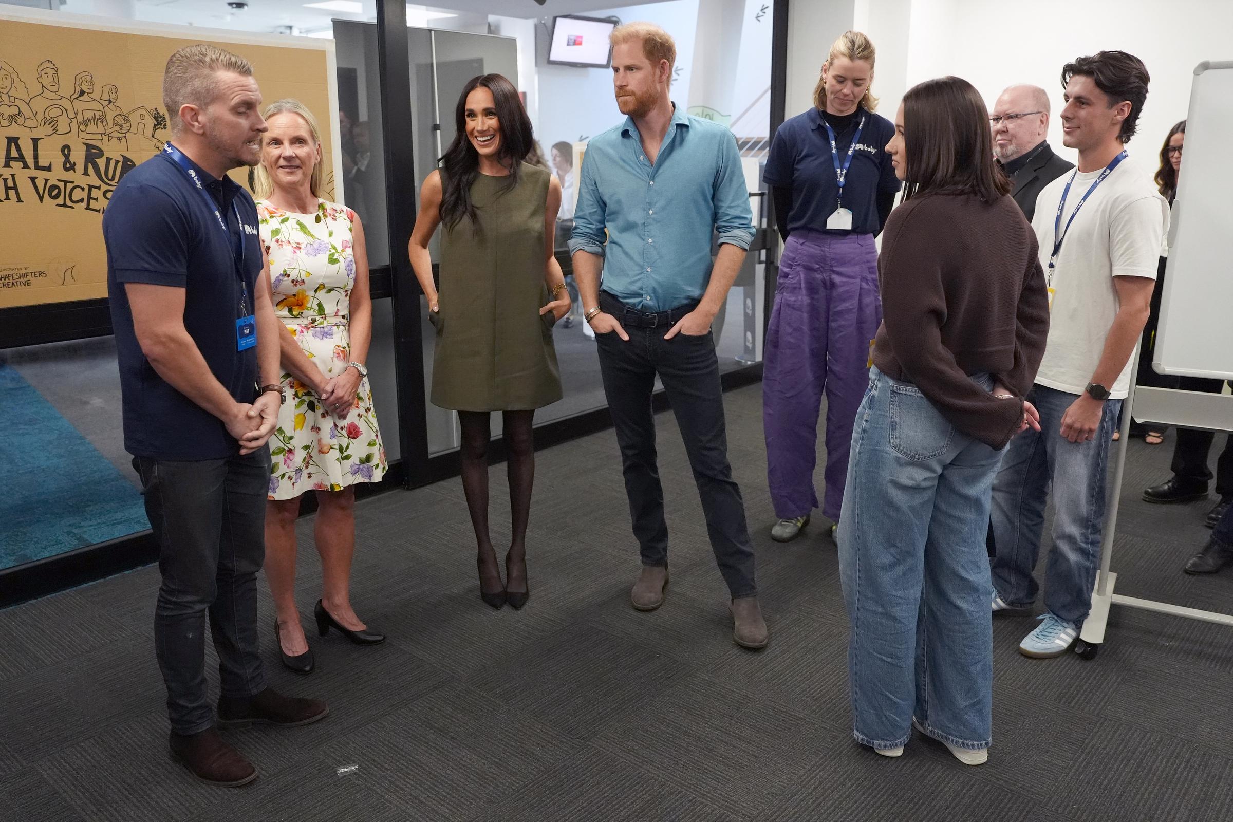 Prince Harry, Duke of Sussex (C) and Meghan, Duchess of Sussex (3rd L) meet staff members and young advocates during a visit to Batyr, a mental health engagement programme, at Swinburne University of Technology on 16 April 2026 in Melbourne, Australia. | Source: Getty Images