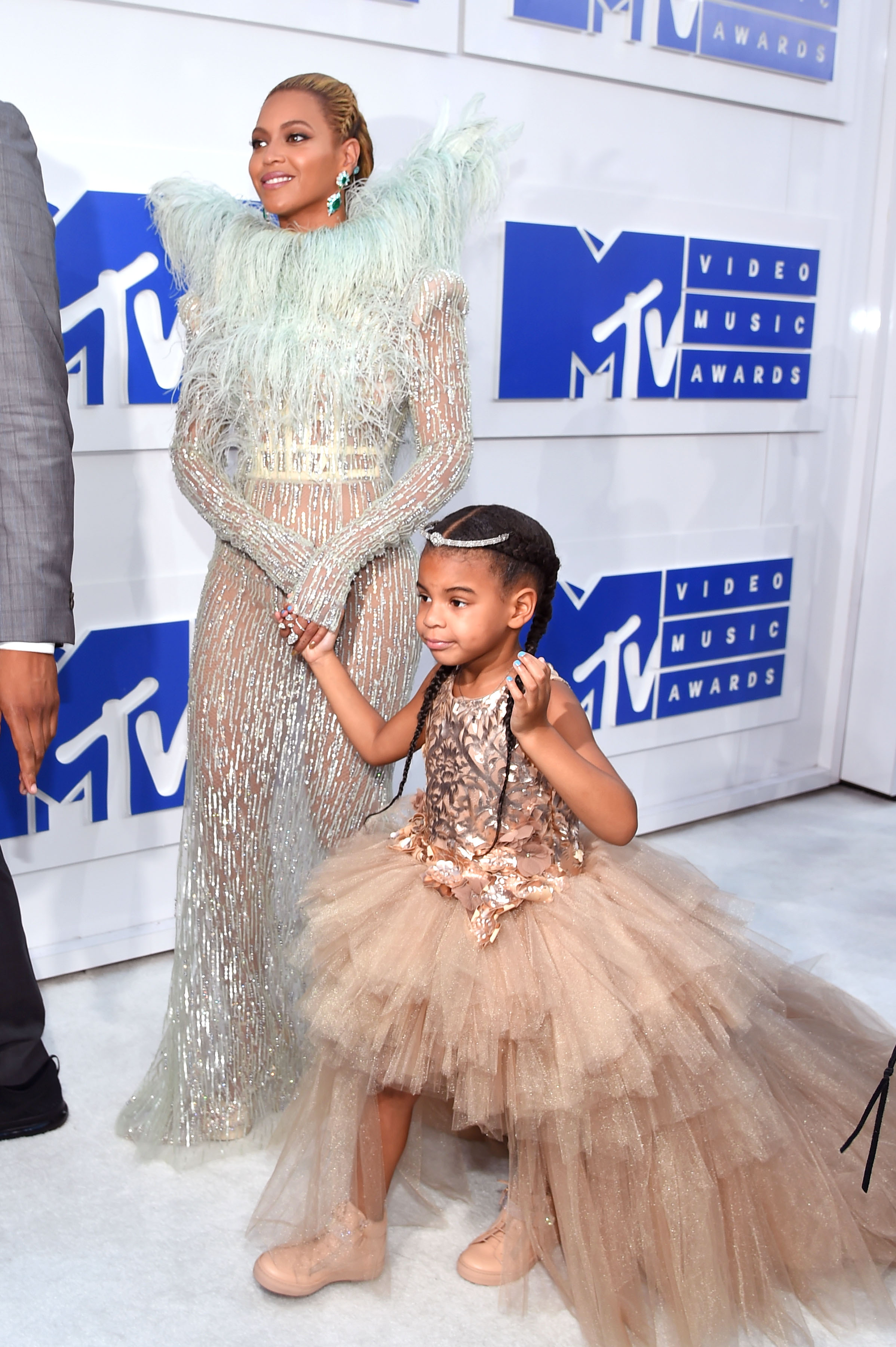 Blue Ivy Carter, 4, wore a tan, high-low ruffled tulle dress with a sequined bodice while holding hands with her mother, Beyoncé, as they attended the MTV Video Music Awards at Madison Square Garden on August 28, 2016, in New York City.