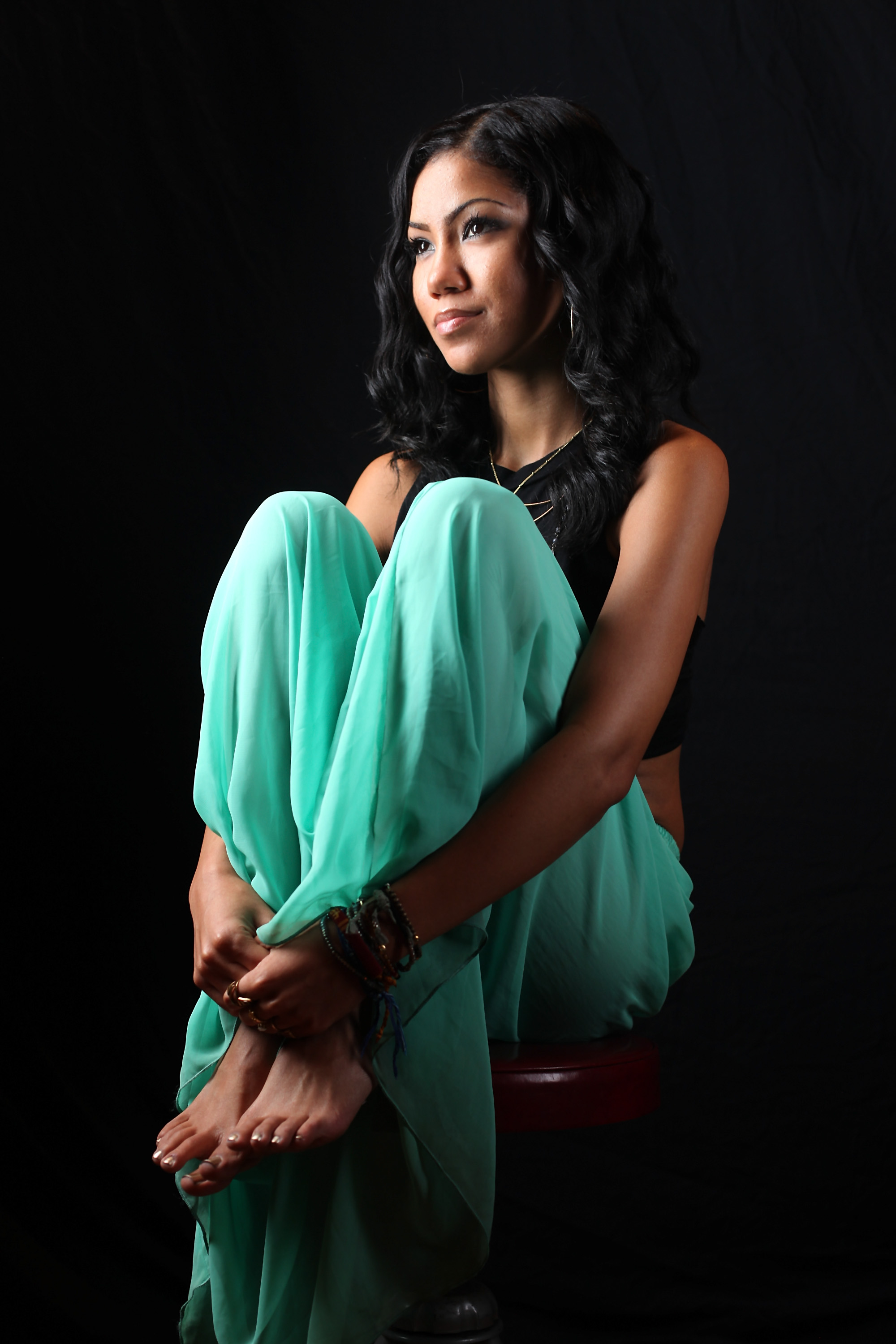 Jhené Aiko poses for a portrait backstage after her performance at 130 Hope Street on October 19, 2012, in the Brooklyn borough of New York City. | Source: Getty Images