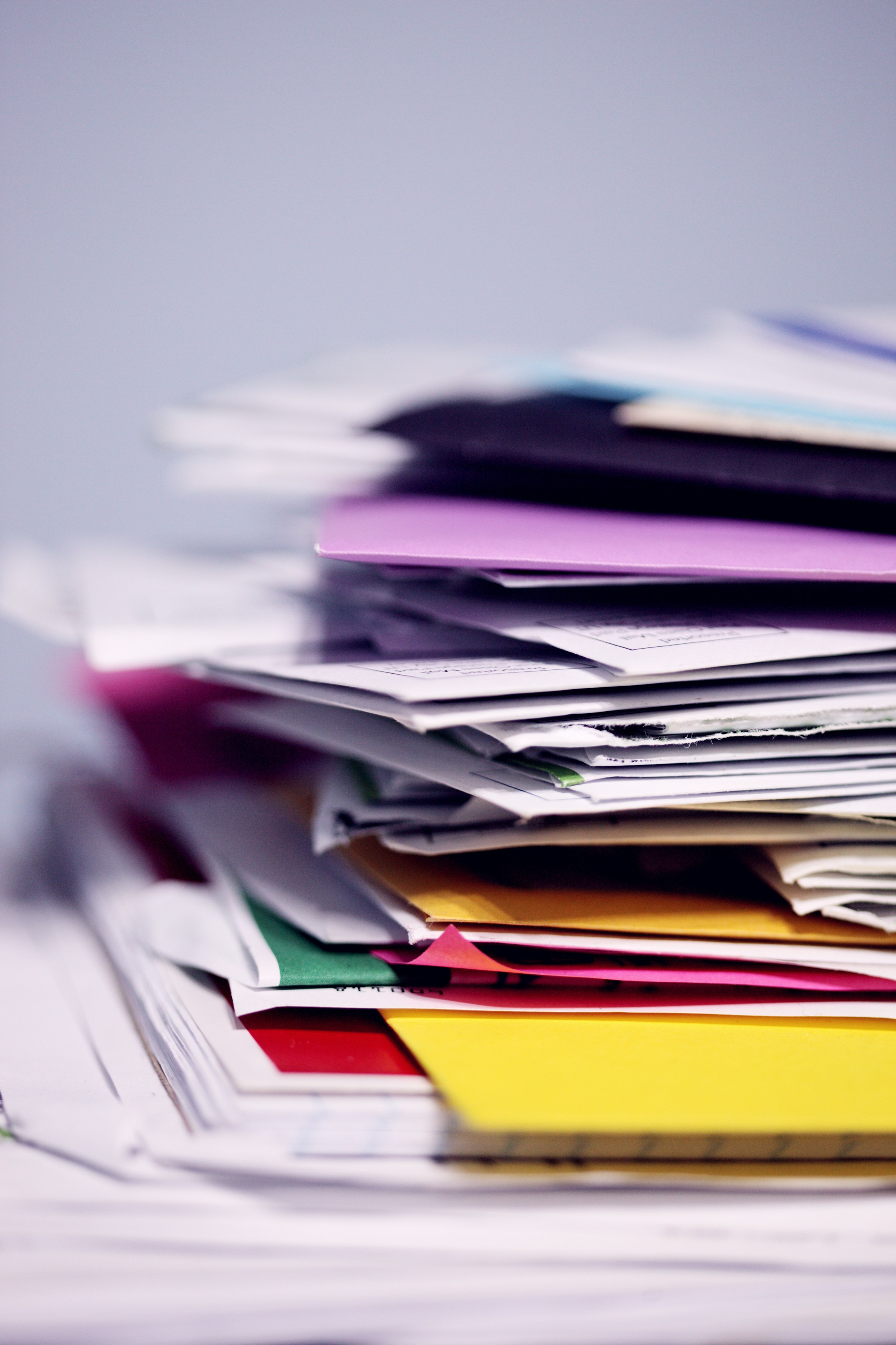 A pile of paperwork on a table | Source: Unsplash