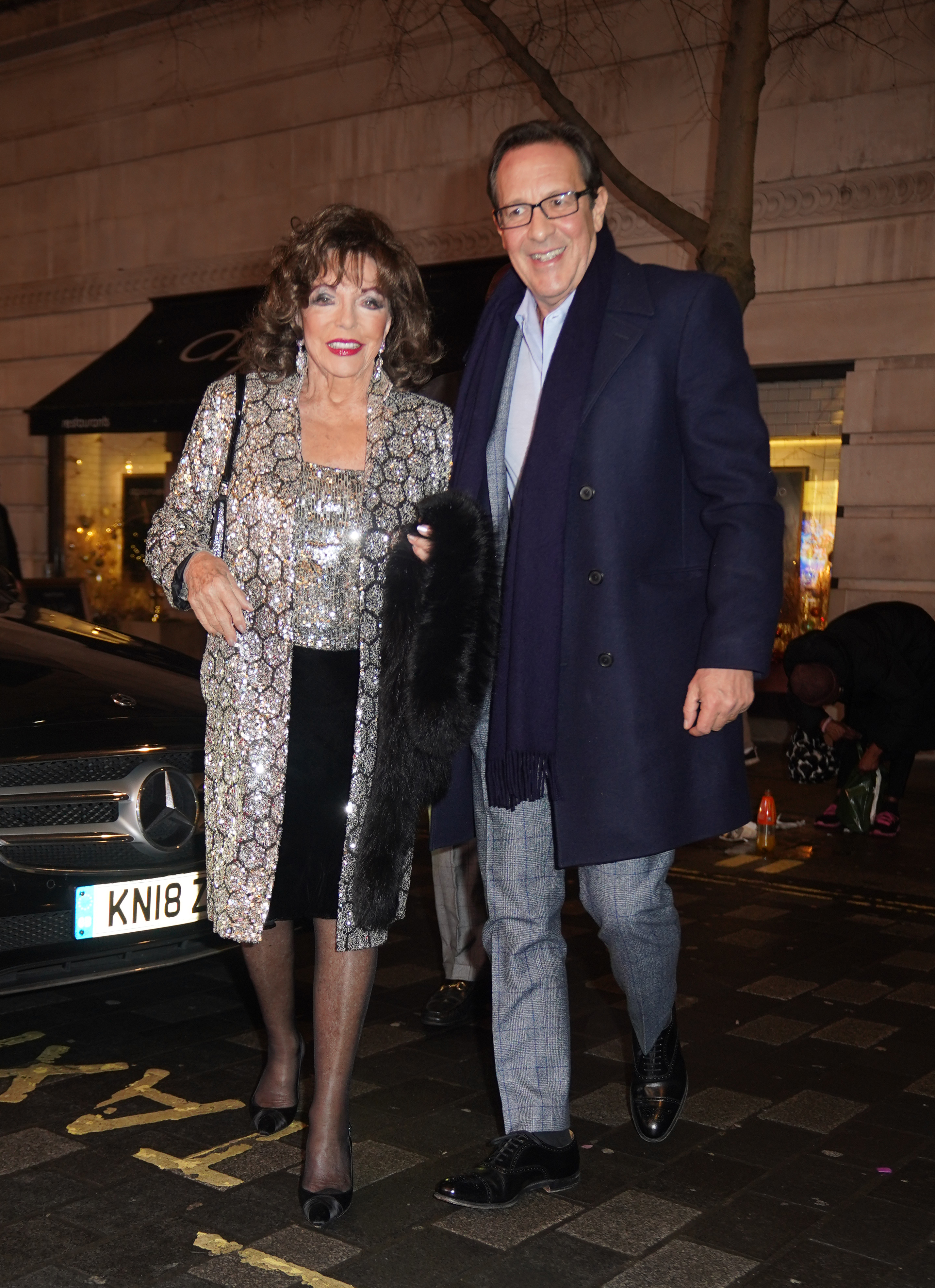 Dame Joan Collins and Percy Gibson at the "Peter Pan" theatre show at London Palladium | Source: Getty Images