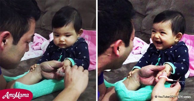 Baby tricks dad and laughs hysterically when he tries to clip her nails