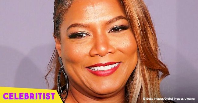 Queen Latifah flaunts her burgundy hair & matching lipstick in grey fringed jacket in new photo