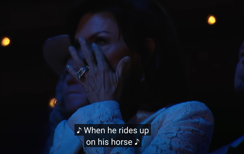 Toby Keith's wife Tricia Lucus crying during his performance | Source: Youtube.com/NBC