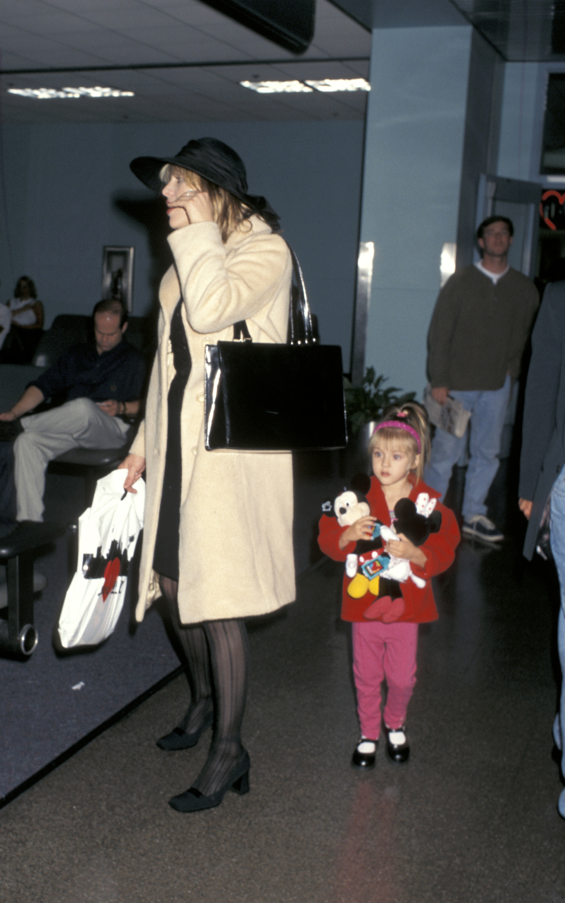 Courtney Love and Frances Bean Cobain at LAX departing for New York on October 9, 1996, in Los Angeles, California | Source: Getty Images