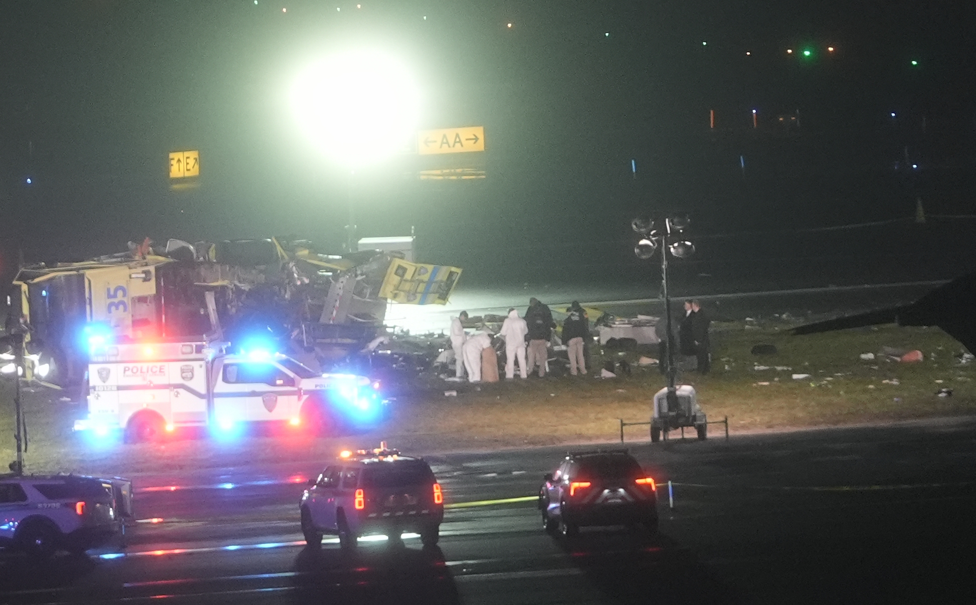 Emergency crews respond at the scene following a runway collision | Source: Getty Images