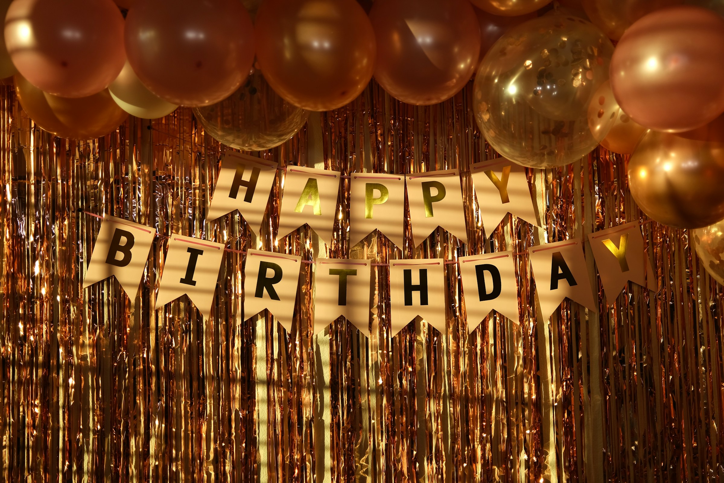 Close-up of birthday banner and decorations | Source: Unsplash