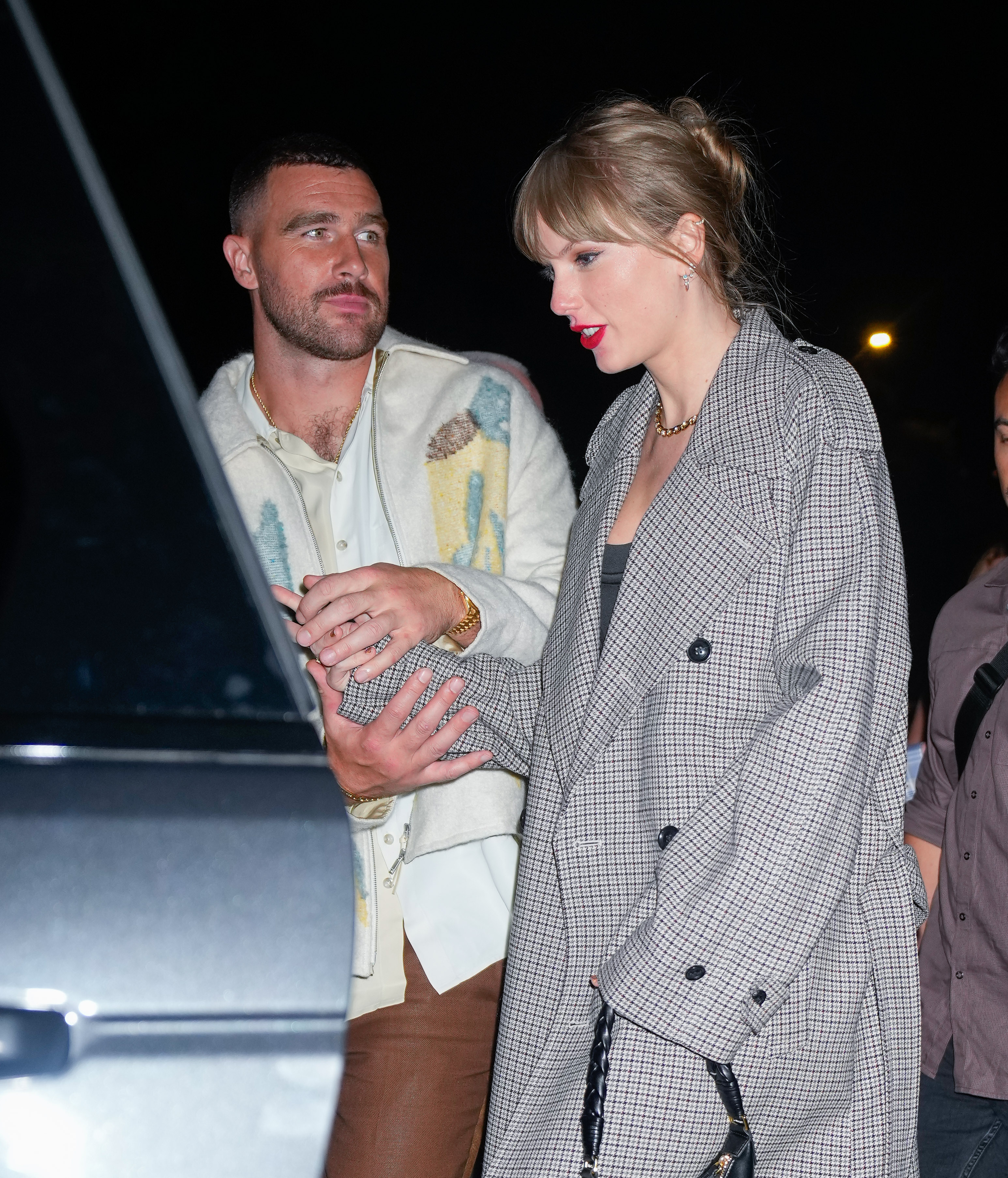 Travis Kelce escorting Taylor Swift as they departed the SNL after-party on October 15, 2023 in New York City | Source: Getty Images