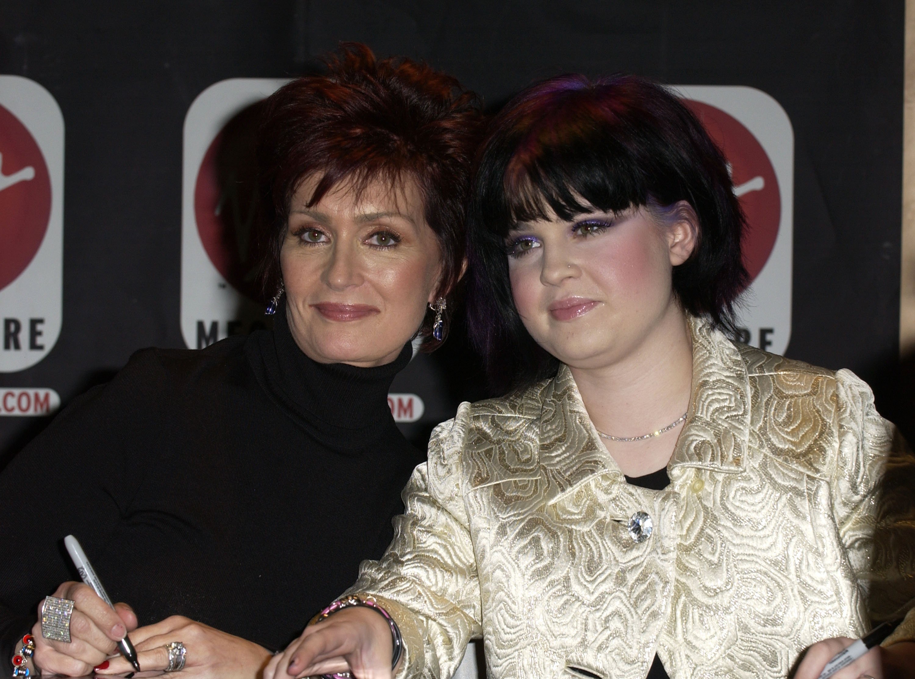 TV host Sharon Osbourne and her daughter Kelly Osbourne during The Osbournes In-Store Appearance for the Release of "The Osbournes First Season" DVD at Virgin Megastore on March 4, 2003 in Los Angeles, California┃Source: Getty Images