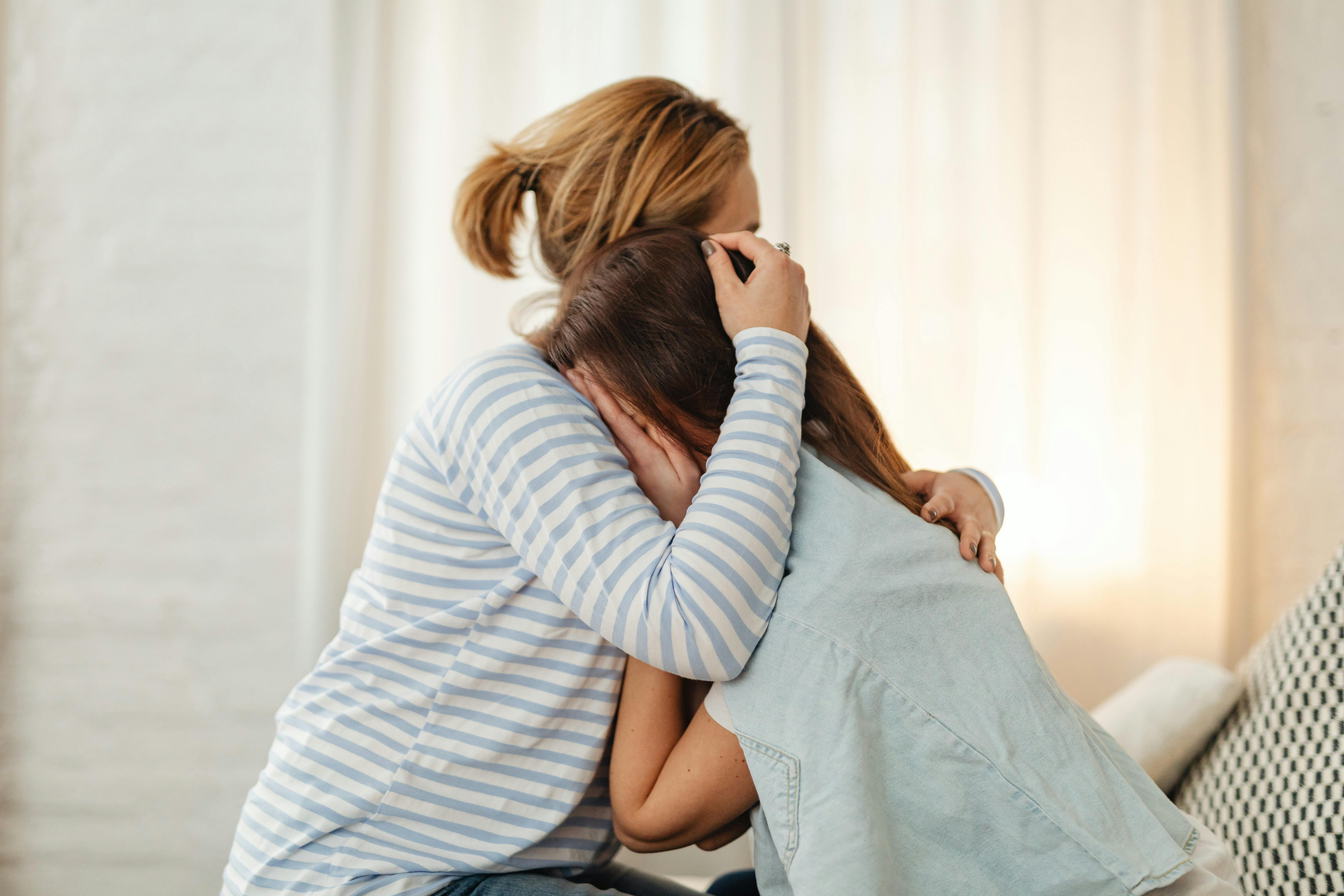A mother comforting her crying daughter | Source: Pexels