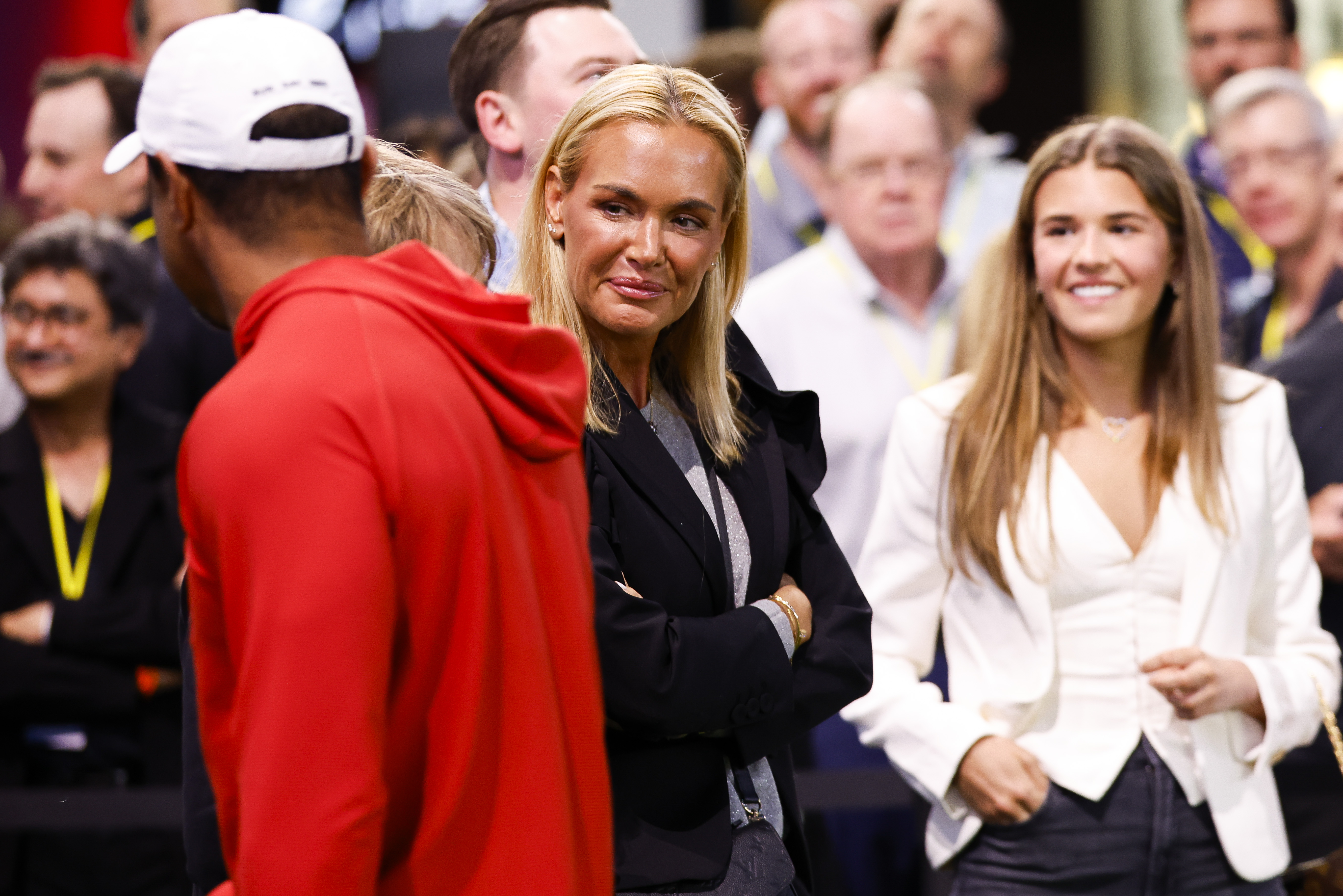 Tiger Woods talks with Vanessa and Kai Trump before a match against The Bay Golf Club on March 3, 2026 | Source: Getty Images