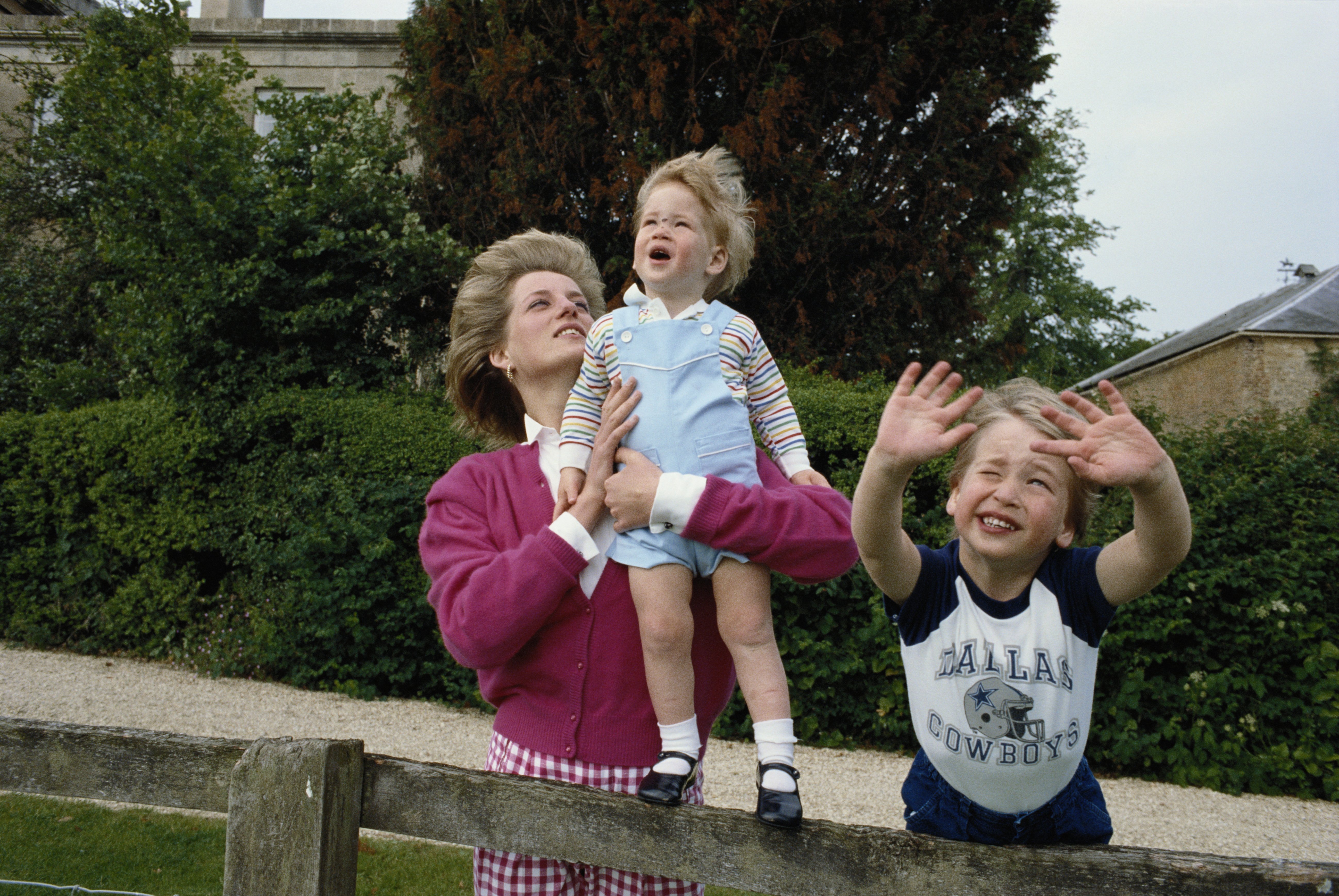 Princes William and Prince Harry with their mother, Princess Diana in the garden of Highgrove House in Gloucestershire, on July 18, 1986 | Source: Getty Images