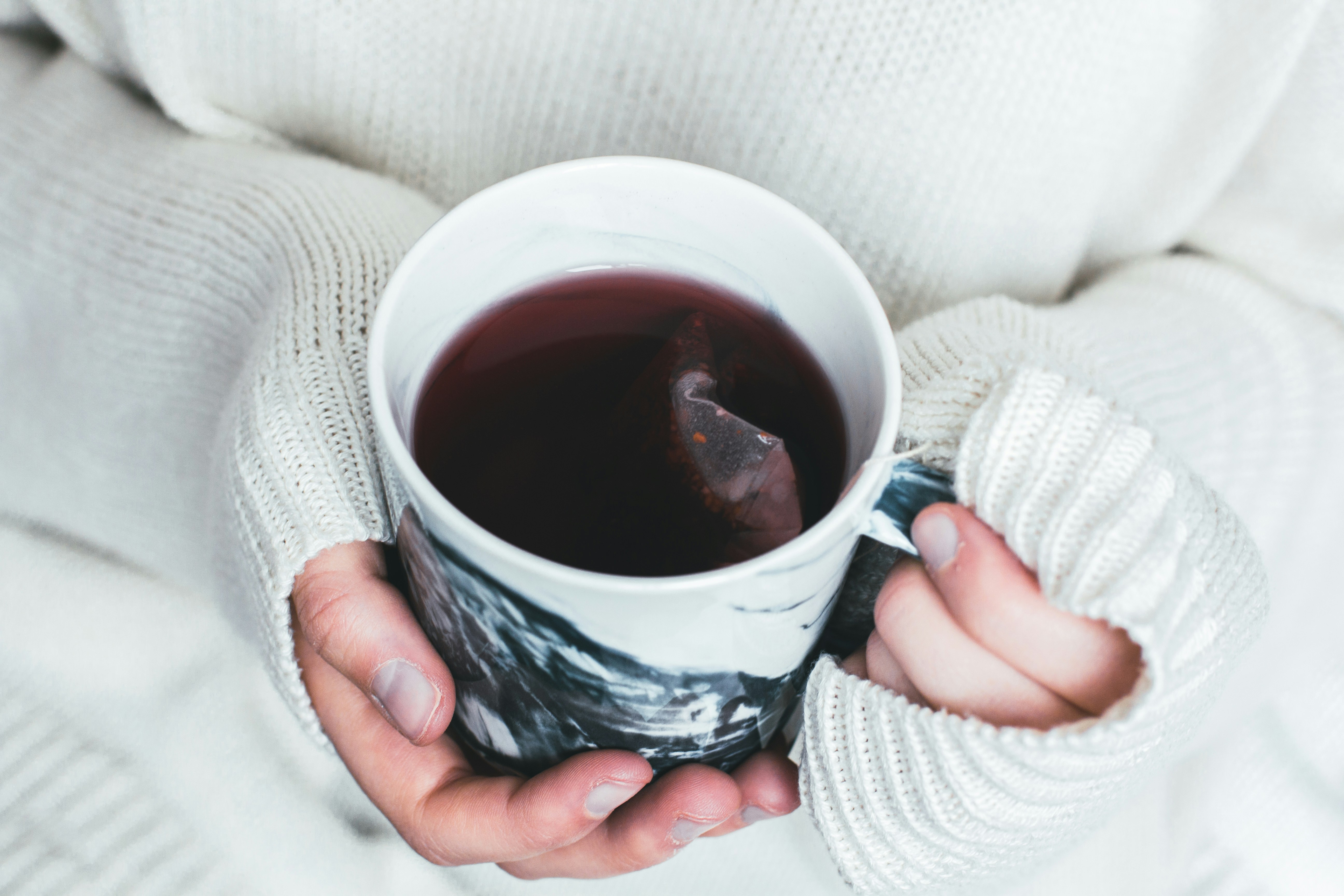 A person holding a cup of tea | Source: Unsplash