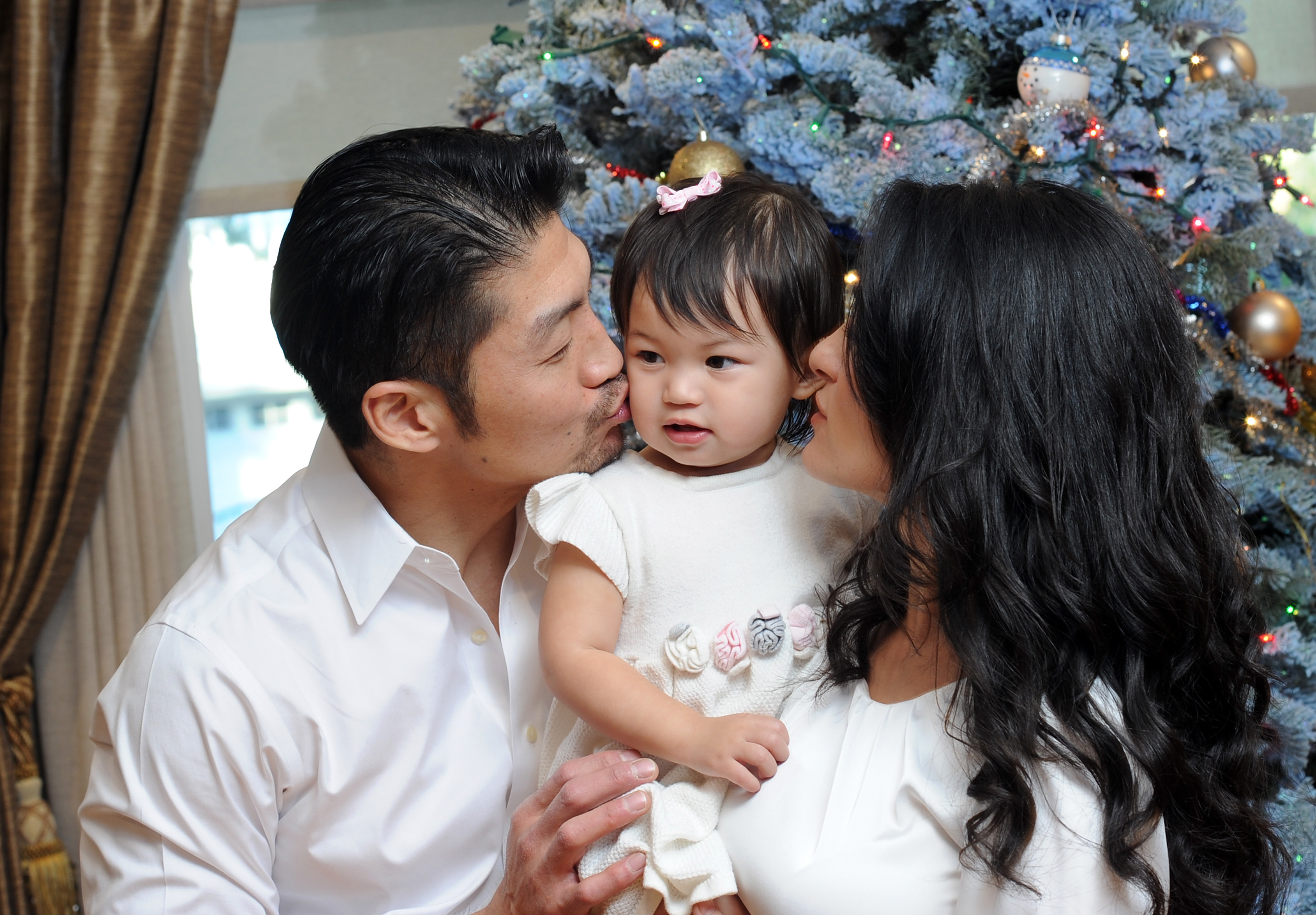 Brian Tee and Mirelly Taylor with daughter Madeline Skyer Tee on December 22, 2016, in Los Angeles, California.  | Source: Getty Images