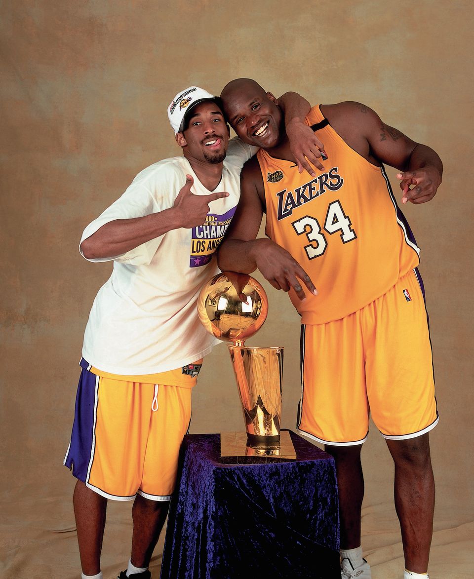 Shaquille O'Neal #34 and Kobe Bryant #8 of the Los Angeles Lakers pose for a photo after winning the NBA Championship on June 19, 2000 at the Staples Center in Los Angeles, California. | Source: Getty Images