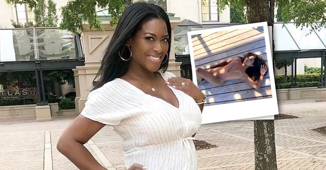 Kenya Moore Flaunts Her Curves In A Stylish Nude Swimsuit While Lying On A Wooden Deck 