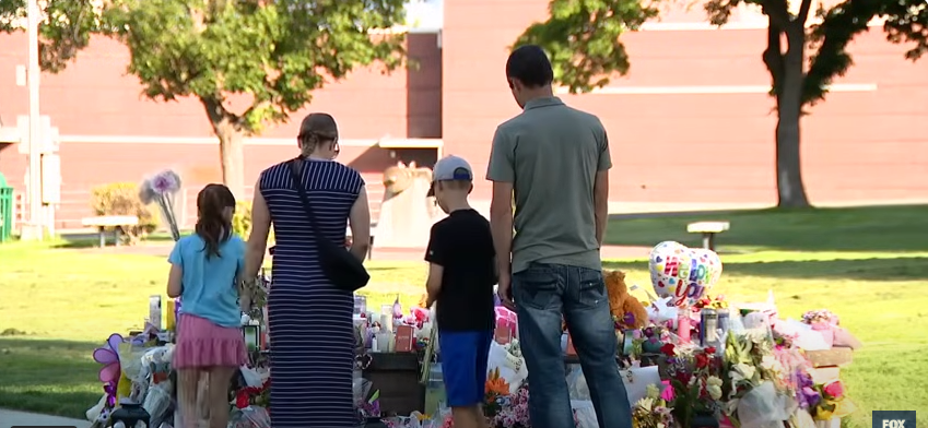 Community conducting a memorial and mourning the loss of the three young sisters | Source: YouTube/fox13seattle
