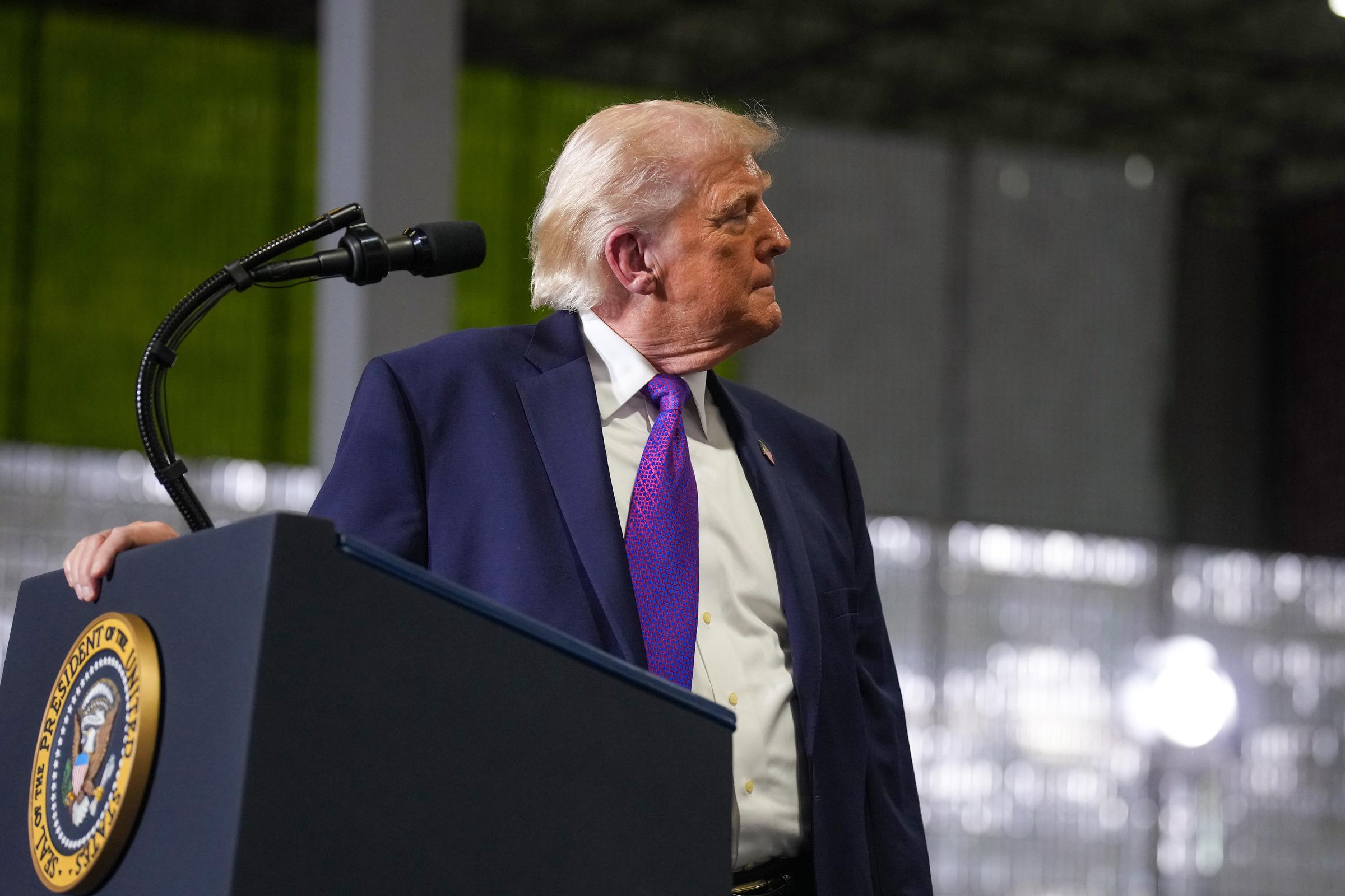Donald Trump pauses during his speech after someone in the audience fainted at Verst Logistics on March 11, 2026 in Hebron, Kentucky | Source: Getty Images