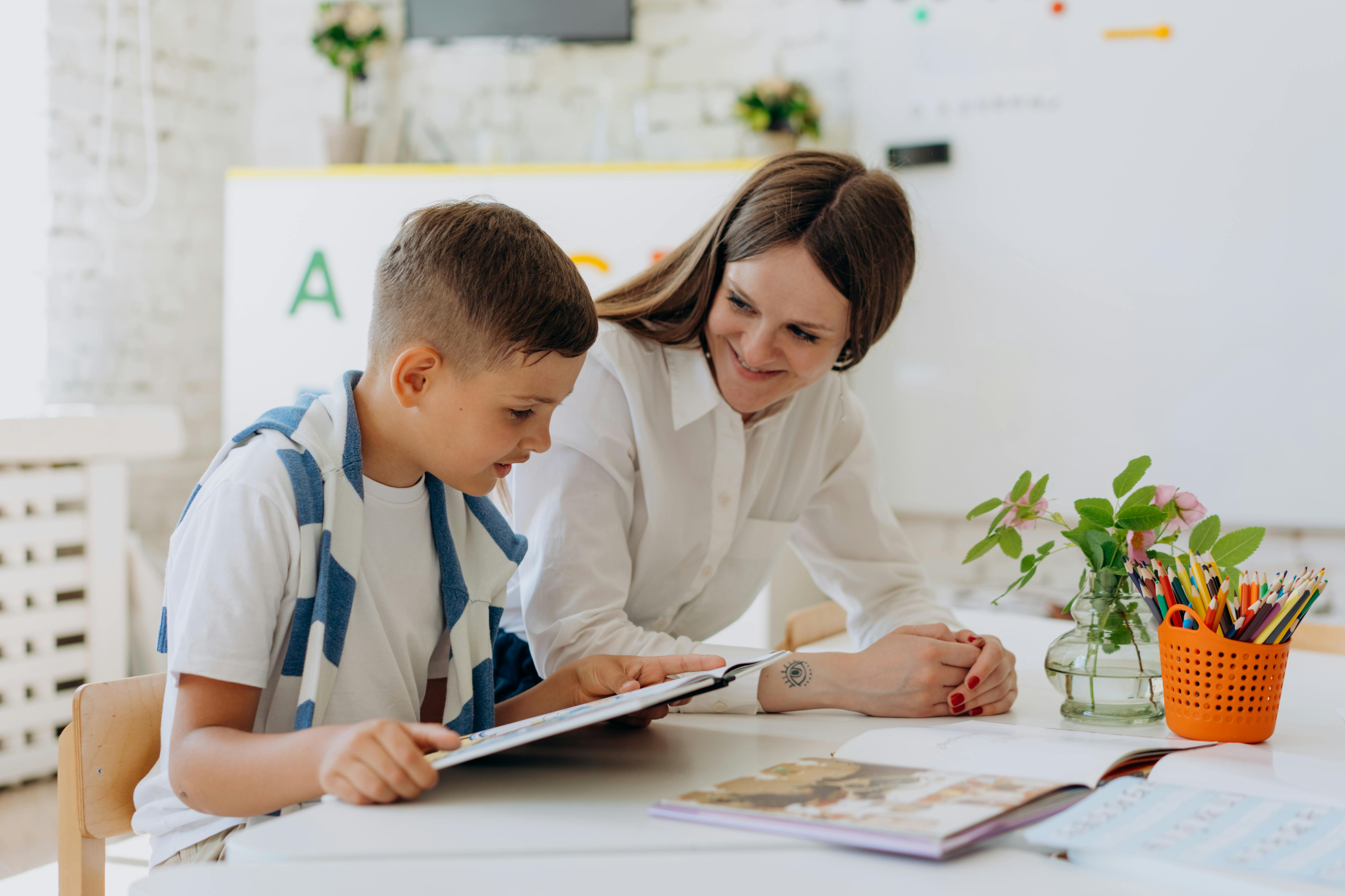 A teacher smiling at her student | Source: Pexels