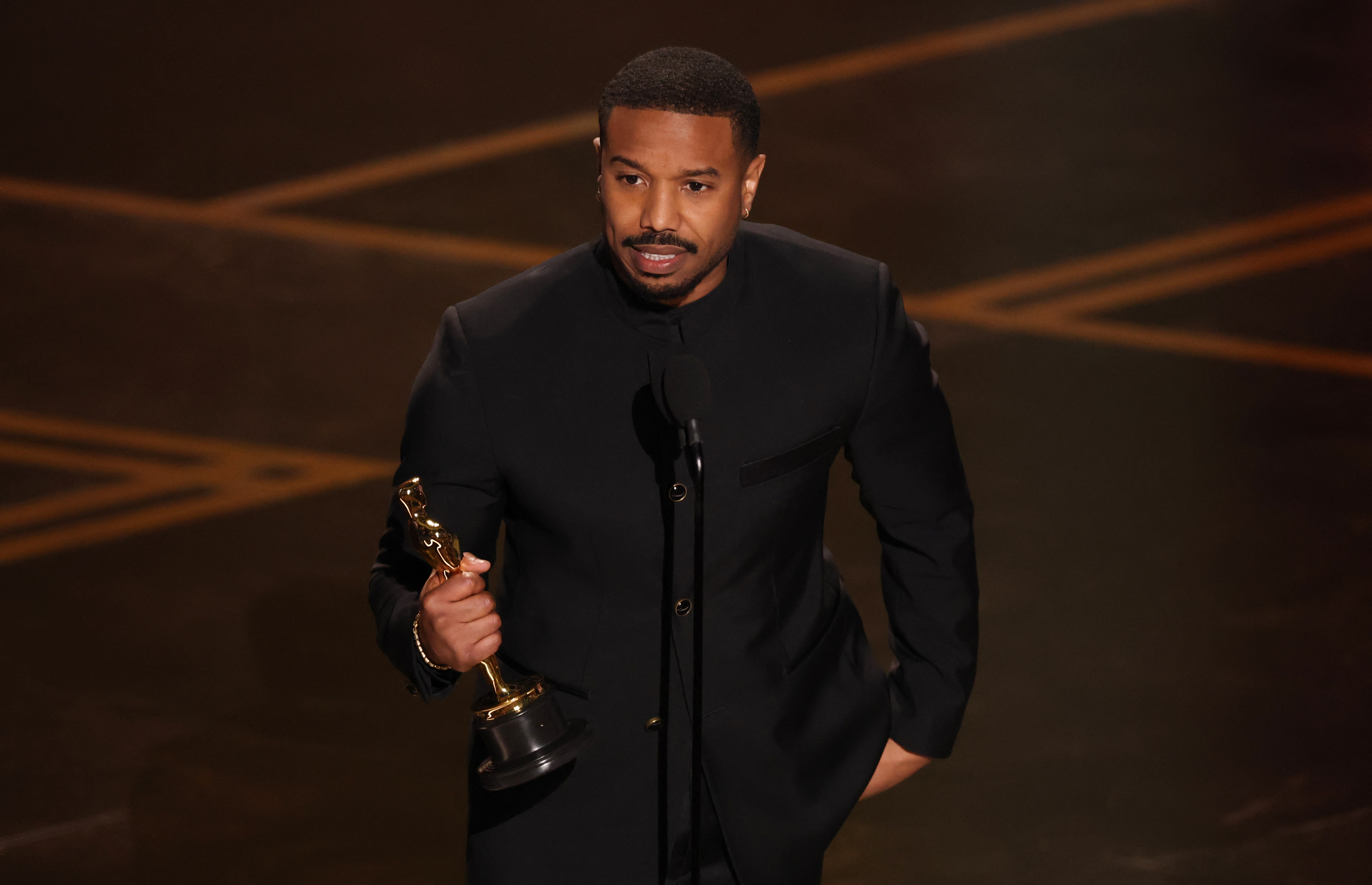 Michael B. Jordan accepts the award for Best Actor in a Leading Role for "Sinners" onstage during the 98th Annual Academy Awards in Hollywood, California on March 15, 2026. | Source: Getty Images