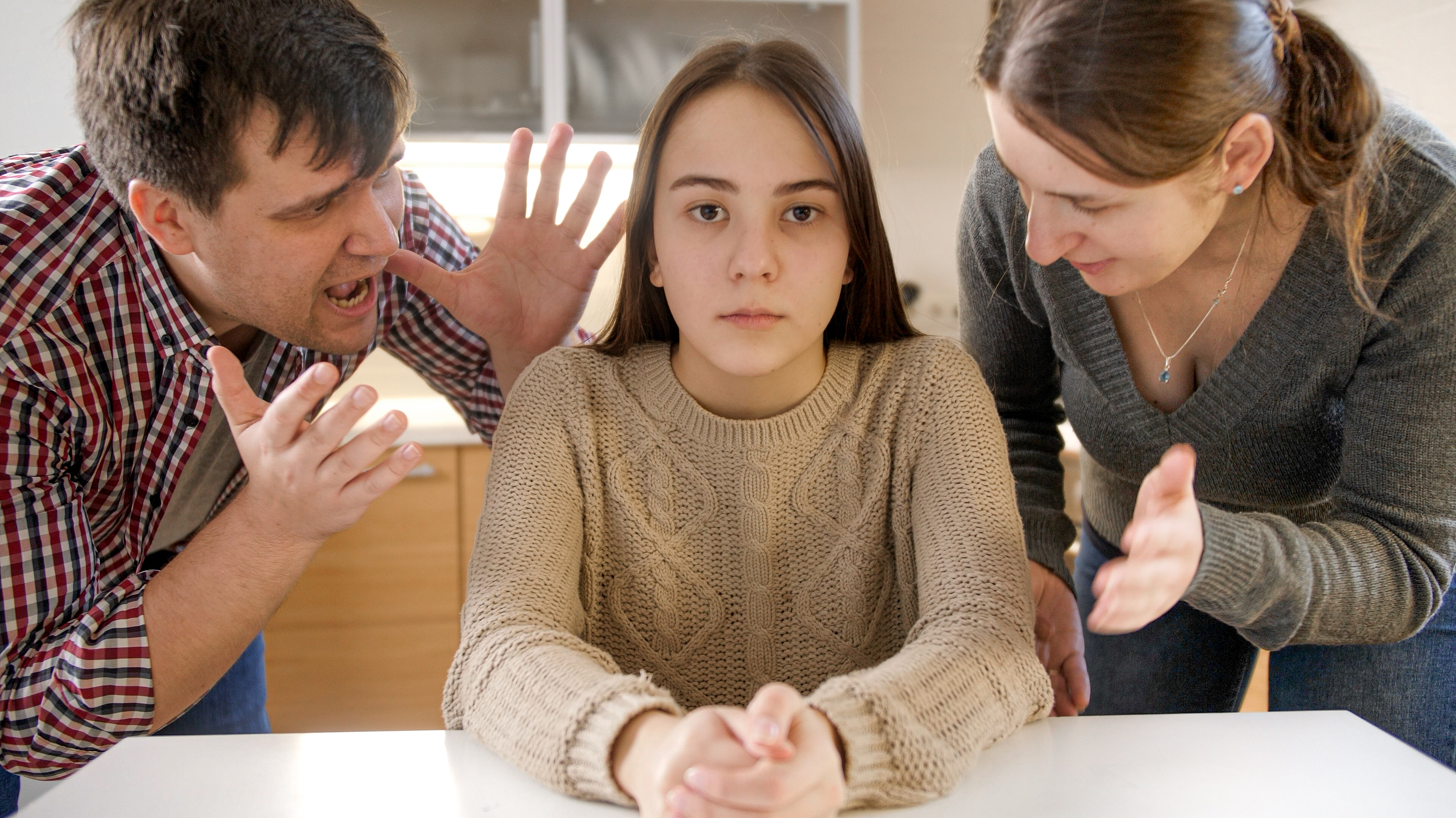 Parents yelling at their daughter | Source: Shutterstock