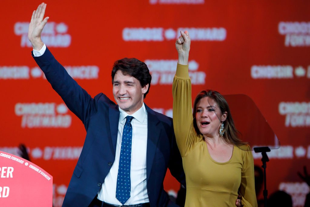 Liberal Leader and Canadian Prime Minister Justin Trudeau waves alongside his wife Sophie Grégoire Trudeau after delivering his victory speech at his election night headquarters on October 21, 2019 in Montreal, Canada | Photo: Getty Images