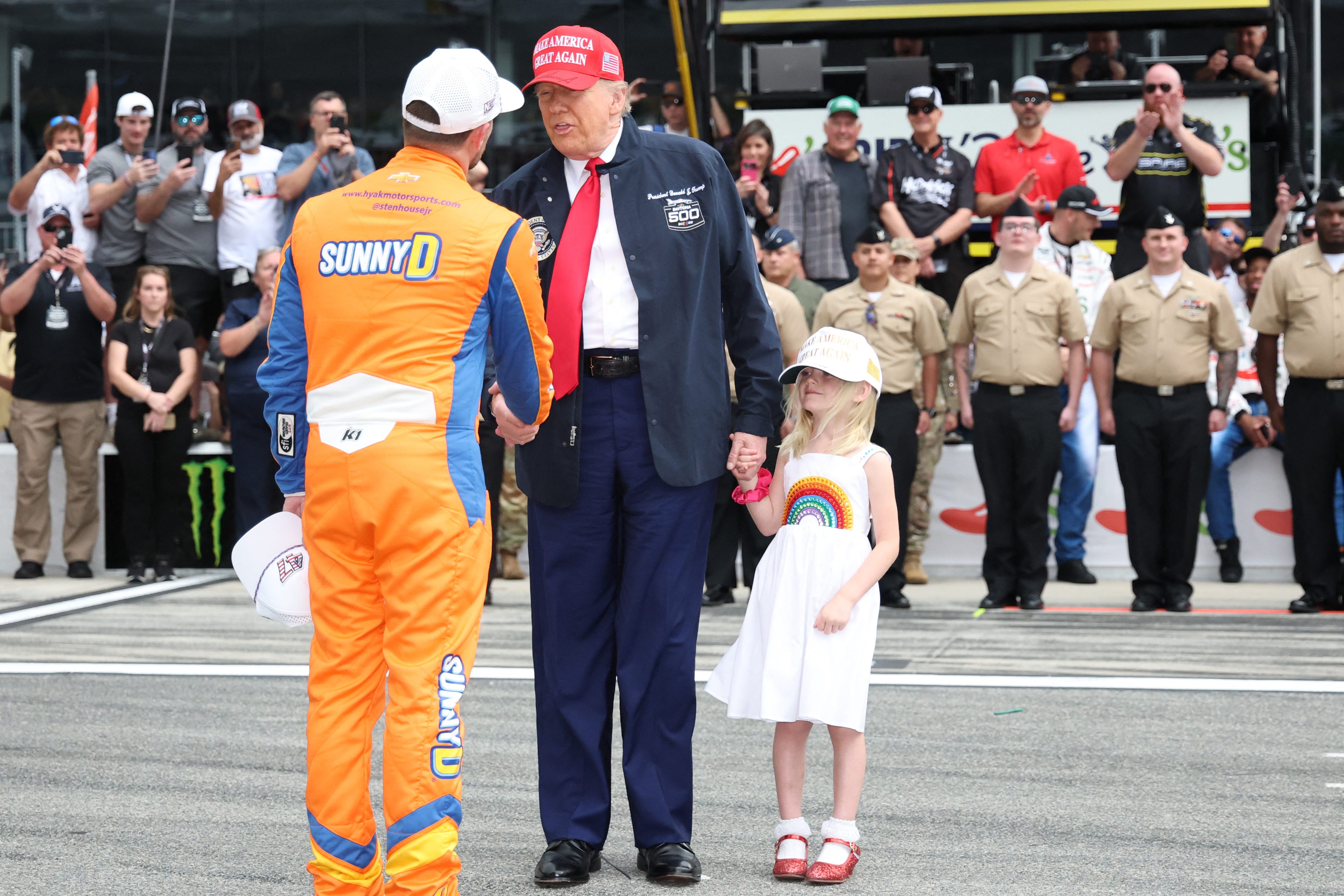 Donald Trump greeting driver Ricky Stenhouse Jr. prior to the race on February 16, 2025, in Daytona Beach, Florida. | Source: Getty Images