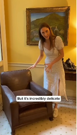 Loxton gestured towards a classic armchair positioned beneath a framed painting, offering another look at the timeless decor inside No. 10 — an aesthetic backdrop that contrasts with the reported selection of newer furnishings linked to Starmer's Downing Street refurbishment. | Source: YouTube/Alice Loxton
