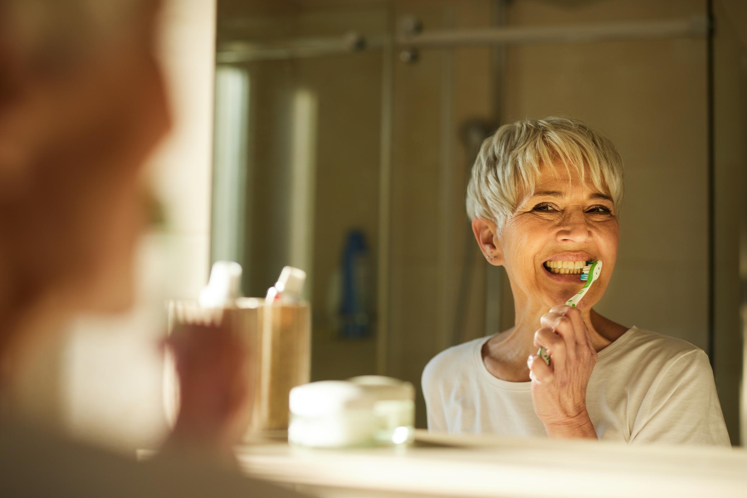A woman brushing her teeth | Source: Getty Images