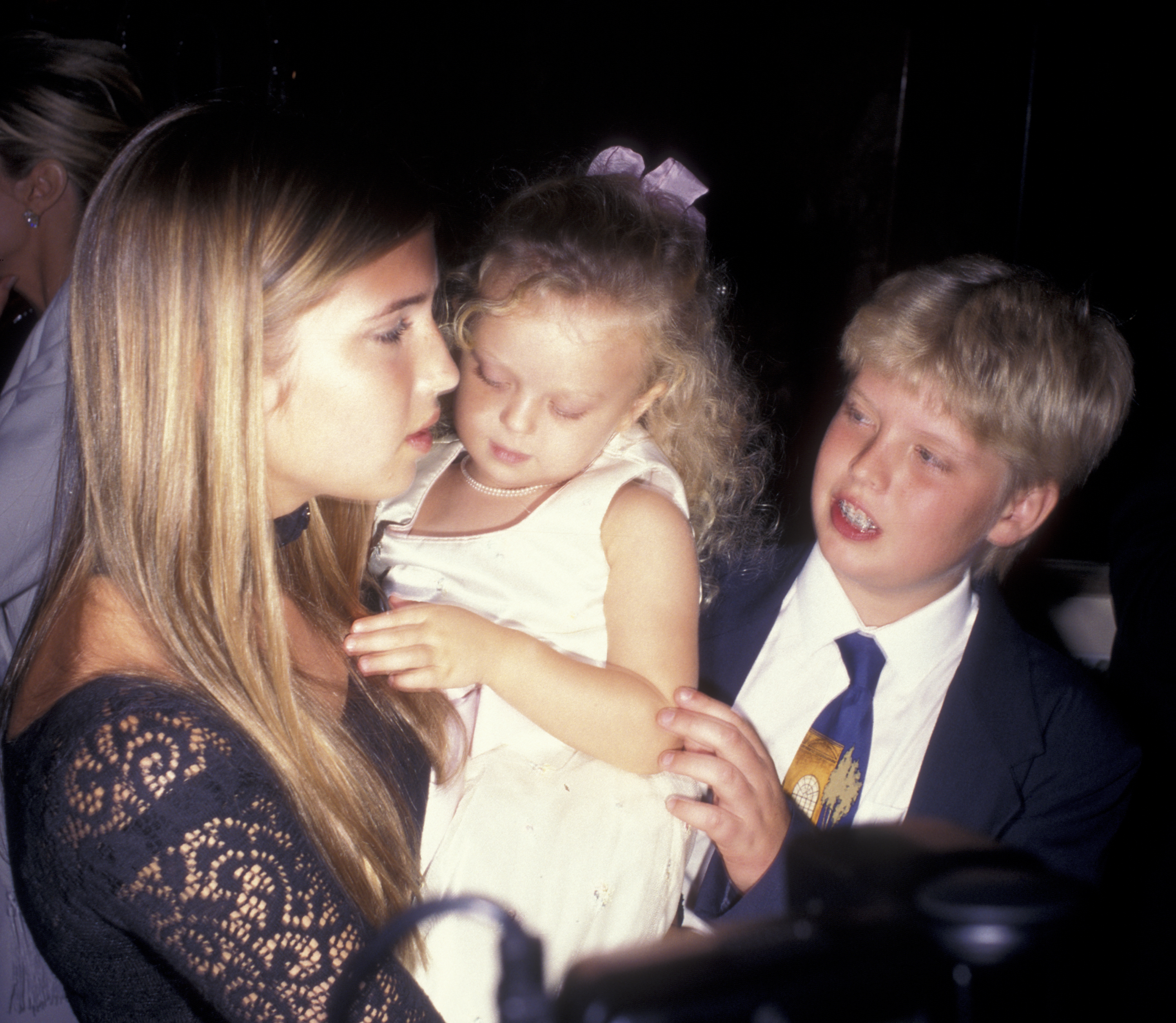 Ivanka and Eric Trump with their younger half-sister at their father's 50th birthday party on June 13, 1996, at Trump Tower in New York. | Source: Getty Images