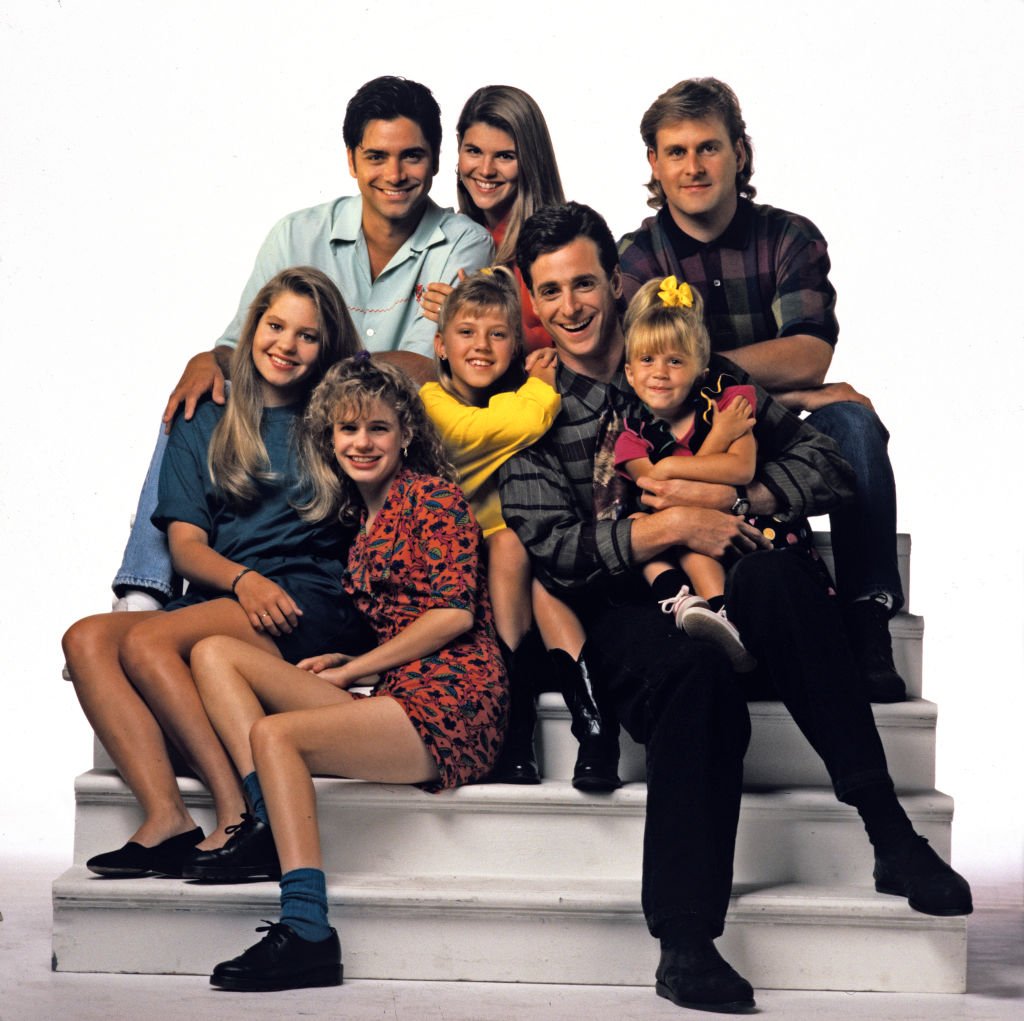 John Stamos, Lori Loughlin, Dave Coulier; Candace Cameron, Andrea Barber, Jodie Sweetin, Bob Saget, Mary-Kate Olsen / Ashley Olsen Season Five promotional photo for the ABC tv series 'Full House', September 3, 1991 | Photo: Getty Images