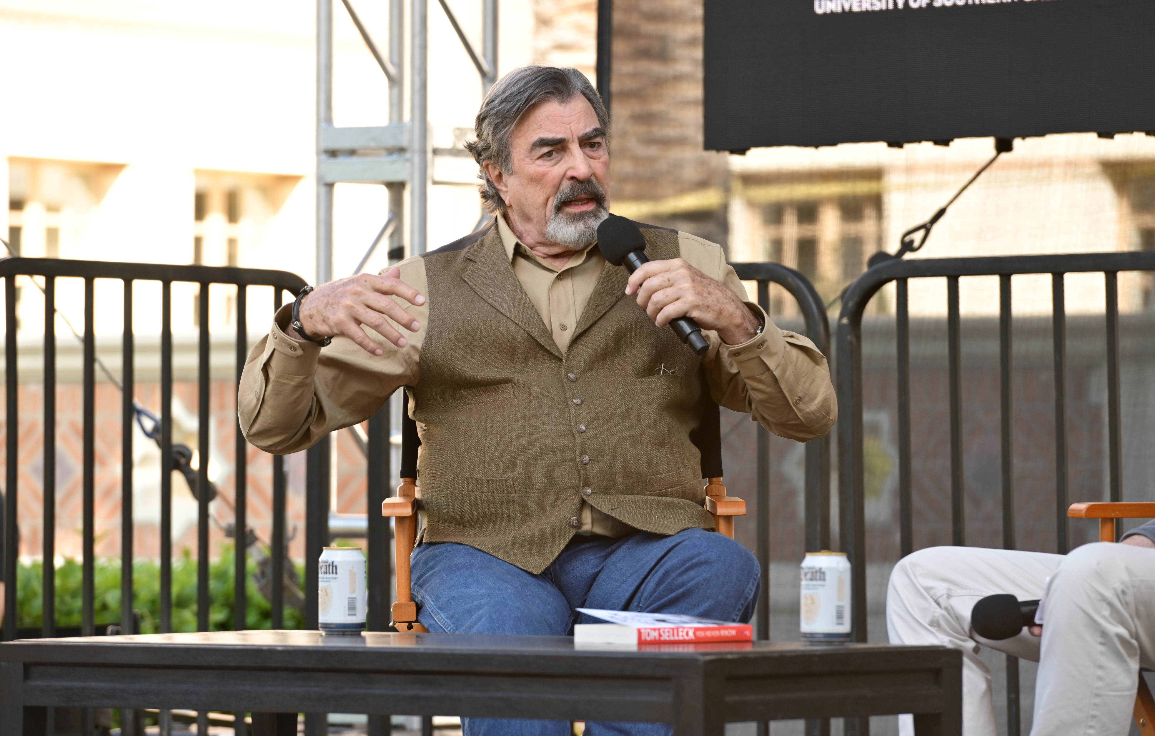 The scammer pretended to be Tom Selleck, who is around the same age as Karen and Donald Whitaker. Here is the actor speaking at the Los Angeles Times Festival of Books at the University of Southern California on April 18, 2026, in Los Angeles, California | Source: Getty Images