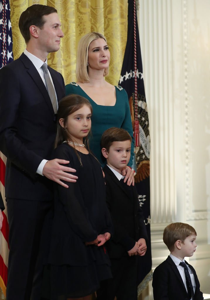 White House senior advisors Jared Kushner and his wife Ivanka Trump stand with their children during a second Hanukkah reception of the evening, in the East Room of the White House. | Photo: Getty Images