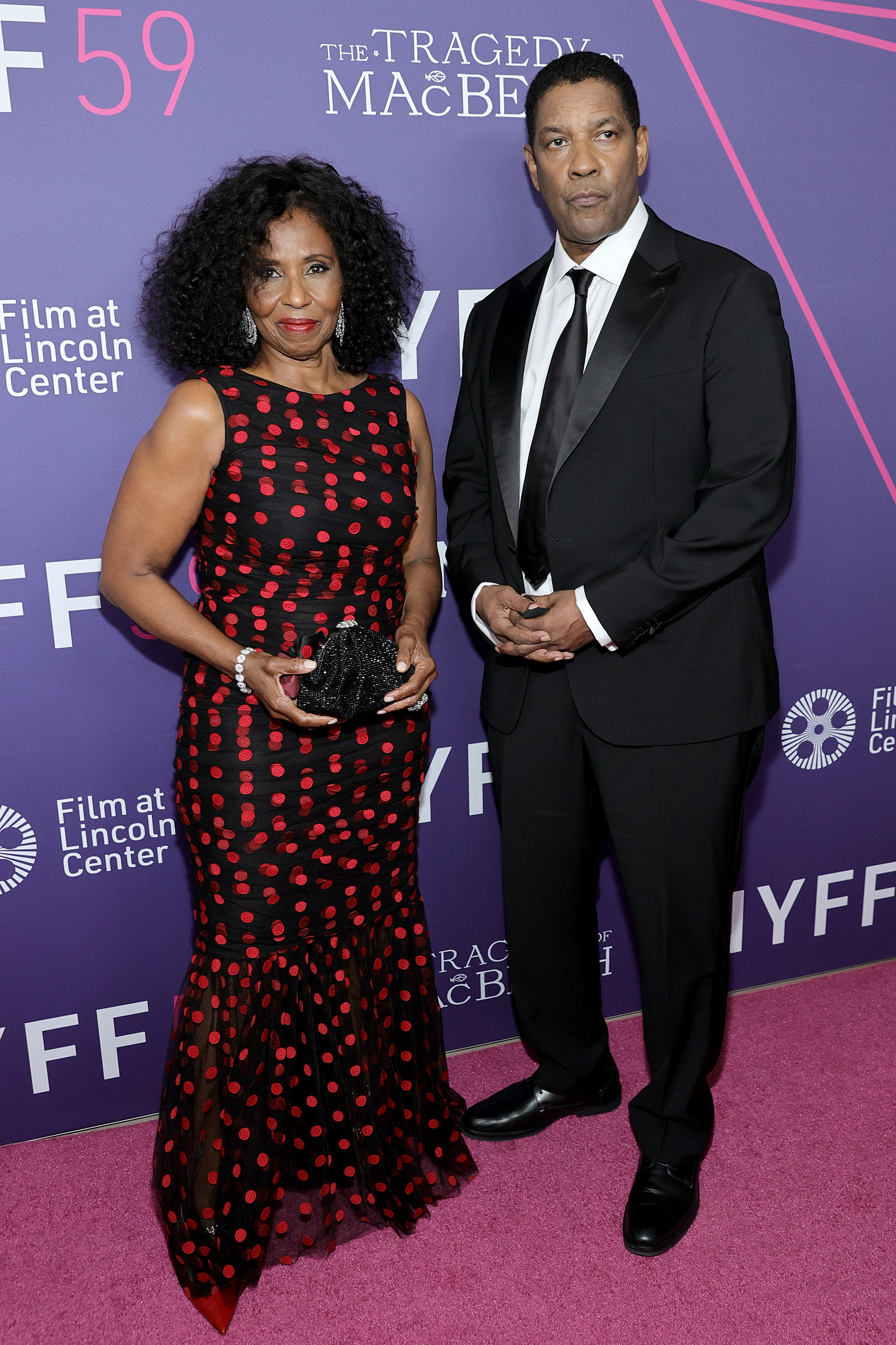 On the red carpet for "The Tragedy of Macbeth," Denzel Washington wears a sleek tux alongside Pauletta Washington. He rocks short, dark hair as he stands poised at the event.