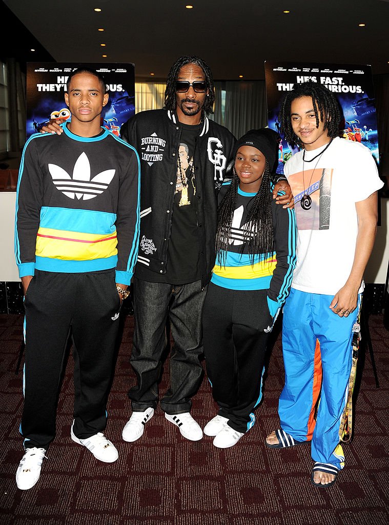 Cordell Broadus, Snoop Dogg, Cori Broadus and Corde Broadus arrive at a special screening of DreamWorks Animation "TURBO" for the Snoop Youth Football League at the Arclight Theatre on July 16, 2013 | Photo: Getty Images