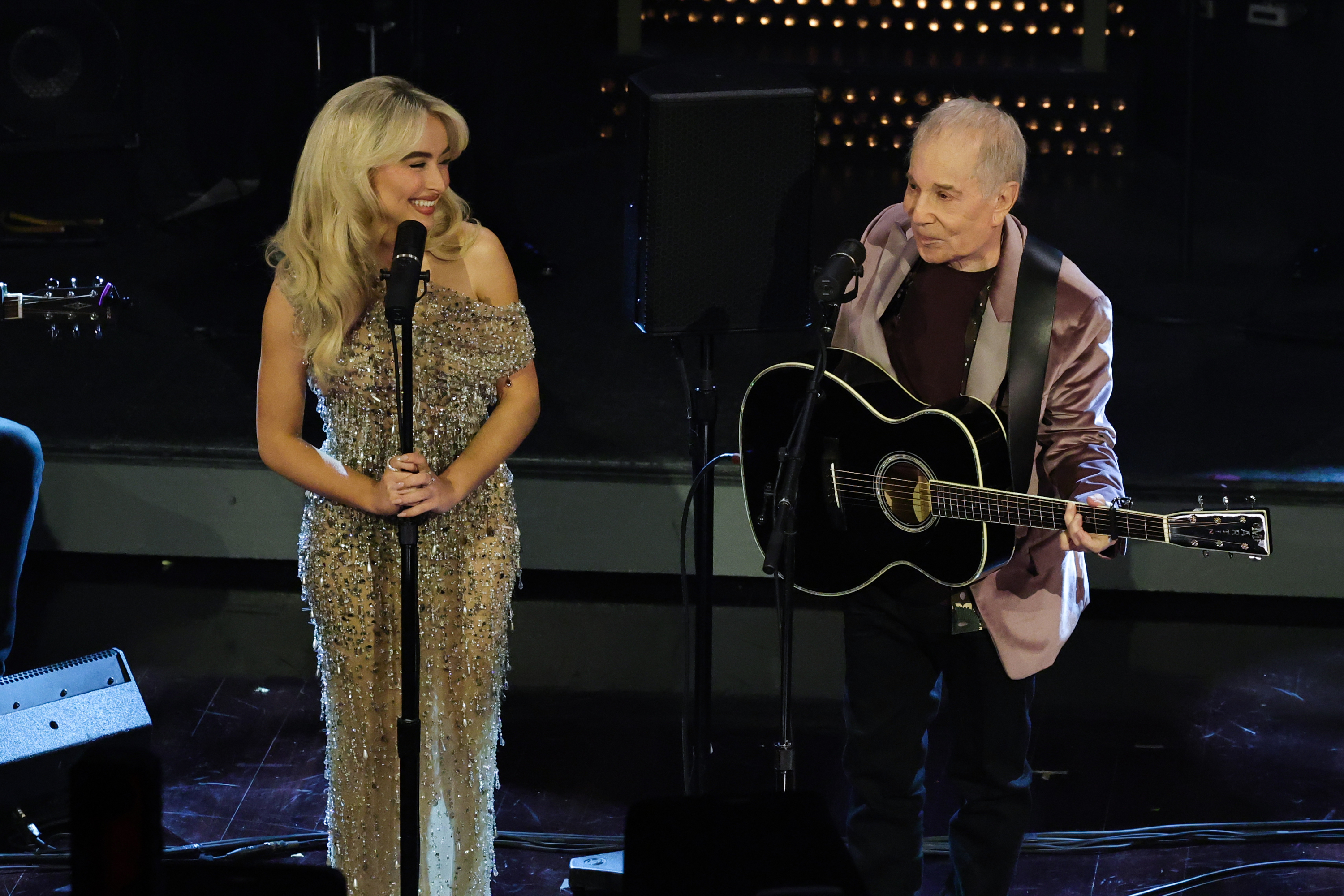 Sabrina Carpenter and Paul Simon during their performance. | Source: Getty Images