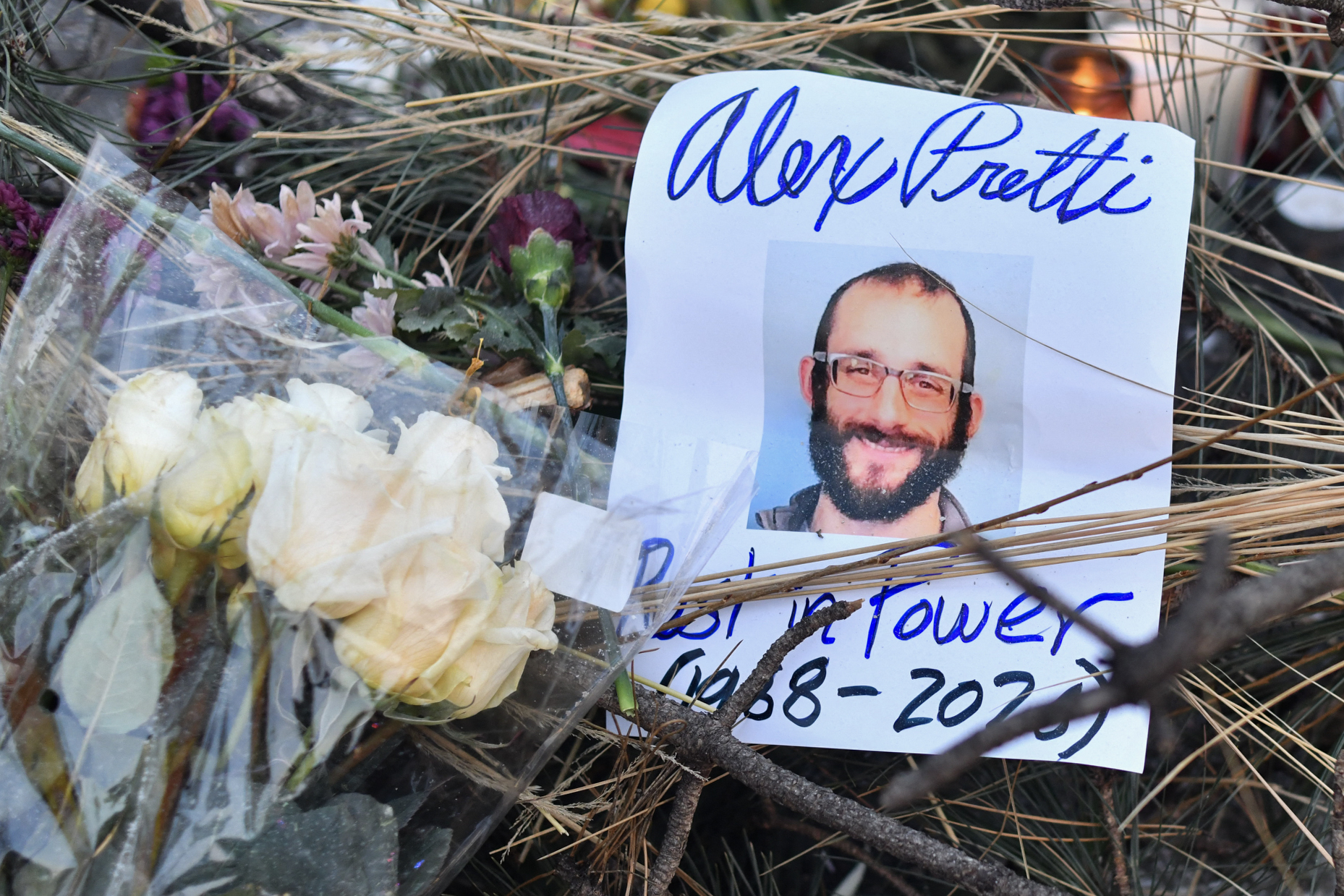 Flowers are left at a makeshift memorial in the area where Alex Pretti was shot dead by federal immigration agents in Minneapolis, Minnesota, on January 25, 2026 | Source: Getty Images