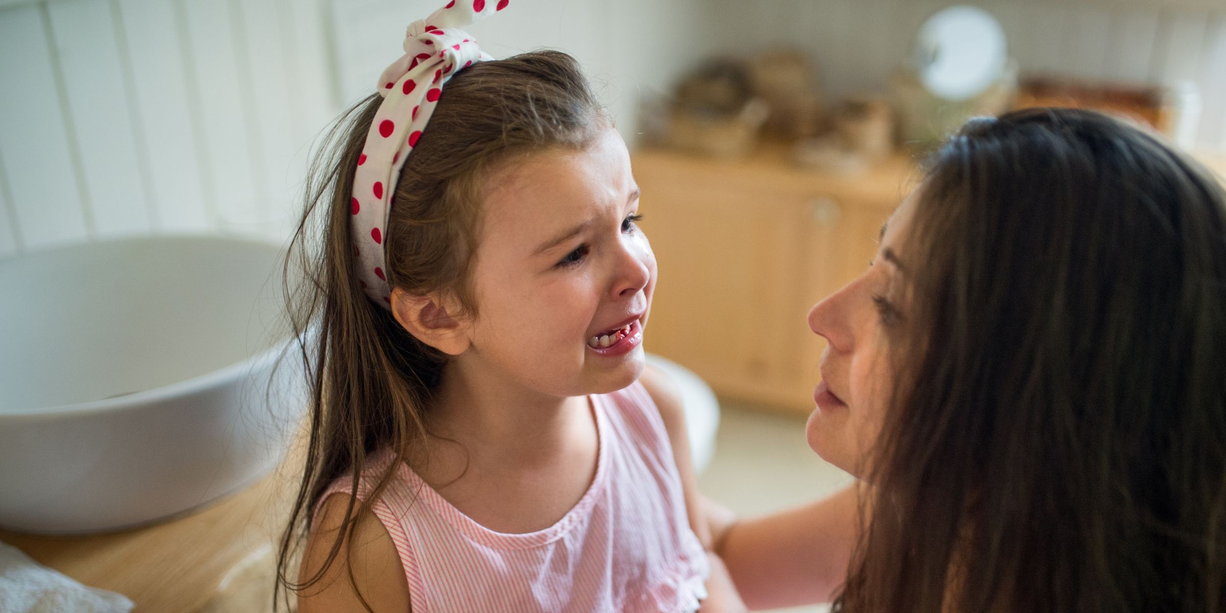 Mother consoling her emotional daughter | Source: Shutterstock