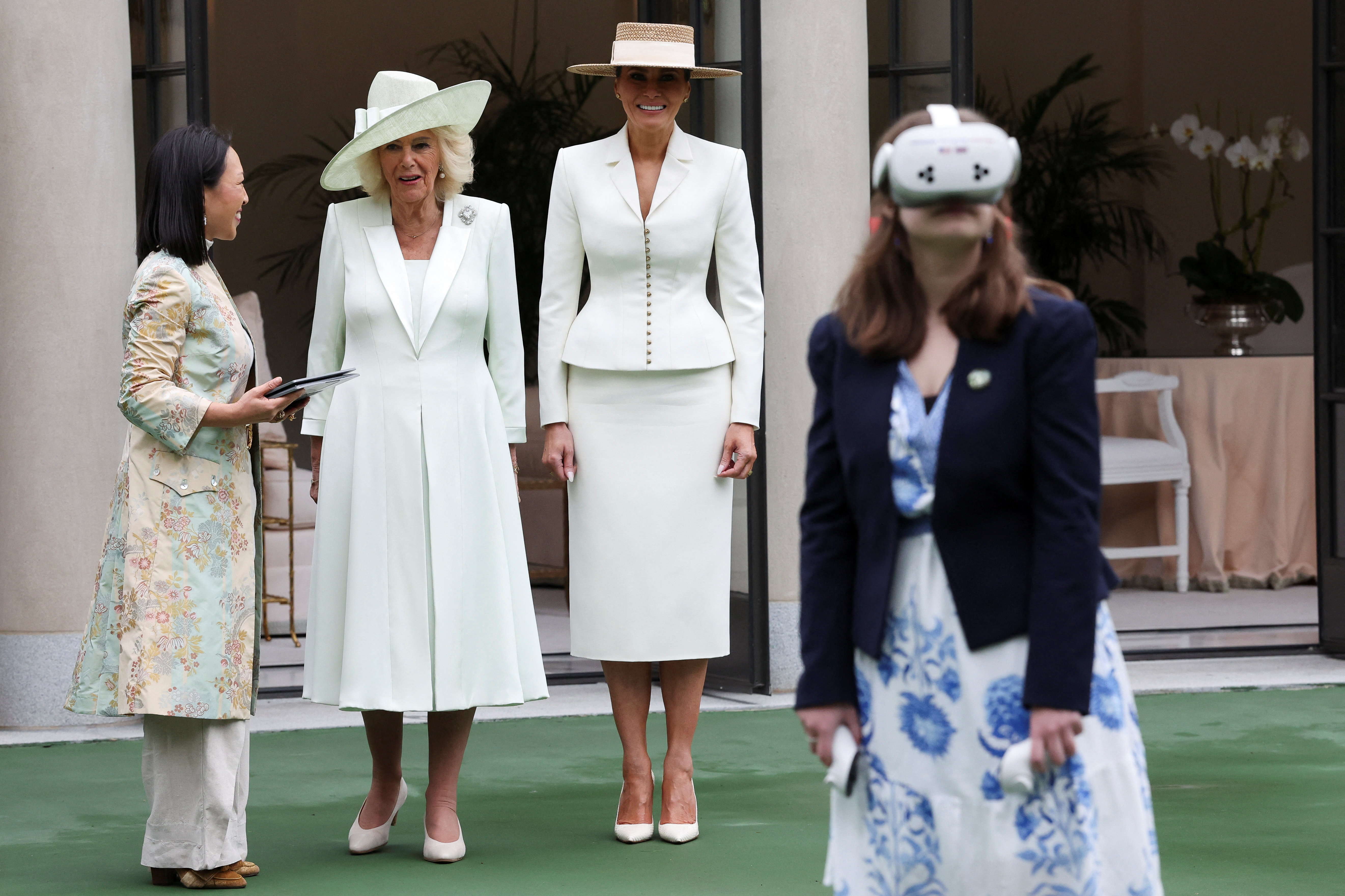 Melania Trump and Queen Camilla watch students use AI-enabled glasses during a cultural educational event at the White House Tennis Pavilion, April 28, 2026. | Source: Getty Images