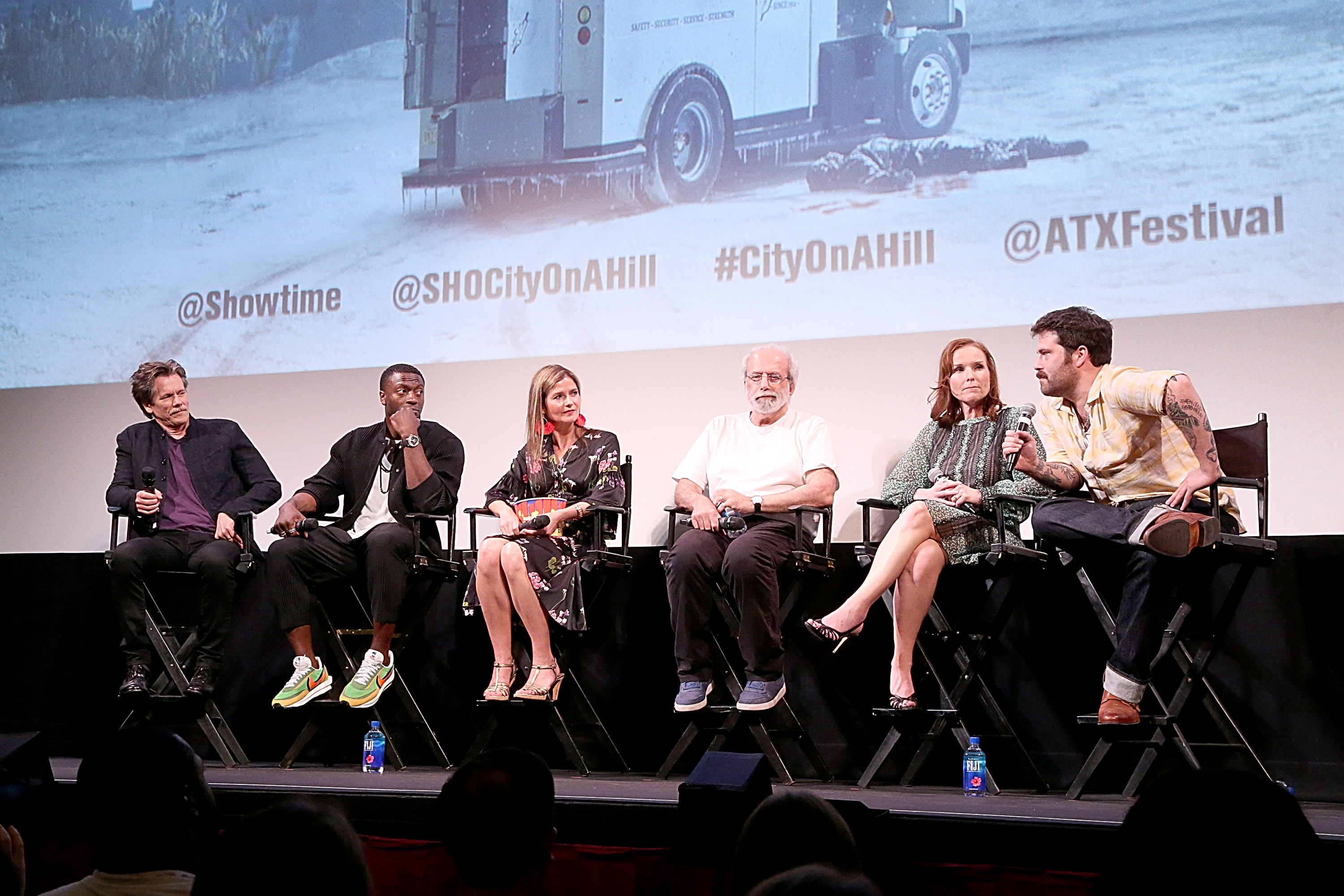 (L - R) Kevin Bacon, Aldis Hodge, Jill Hennessy, Tom Fontana, Jennifer Todd and Chuck MacLean speak onstage during the premiere of "City On A Hill" at the Paramount Theatre during the ATX Television Festival, on June 8, 2019 in Austin, Texas. | Source: Getty Images